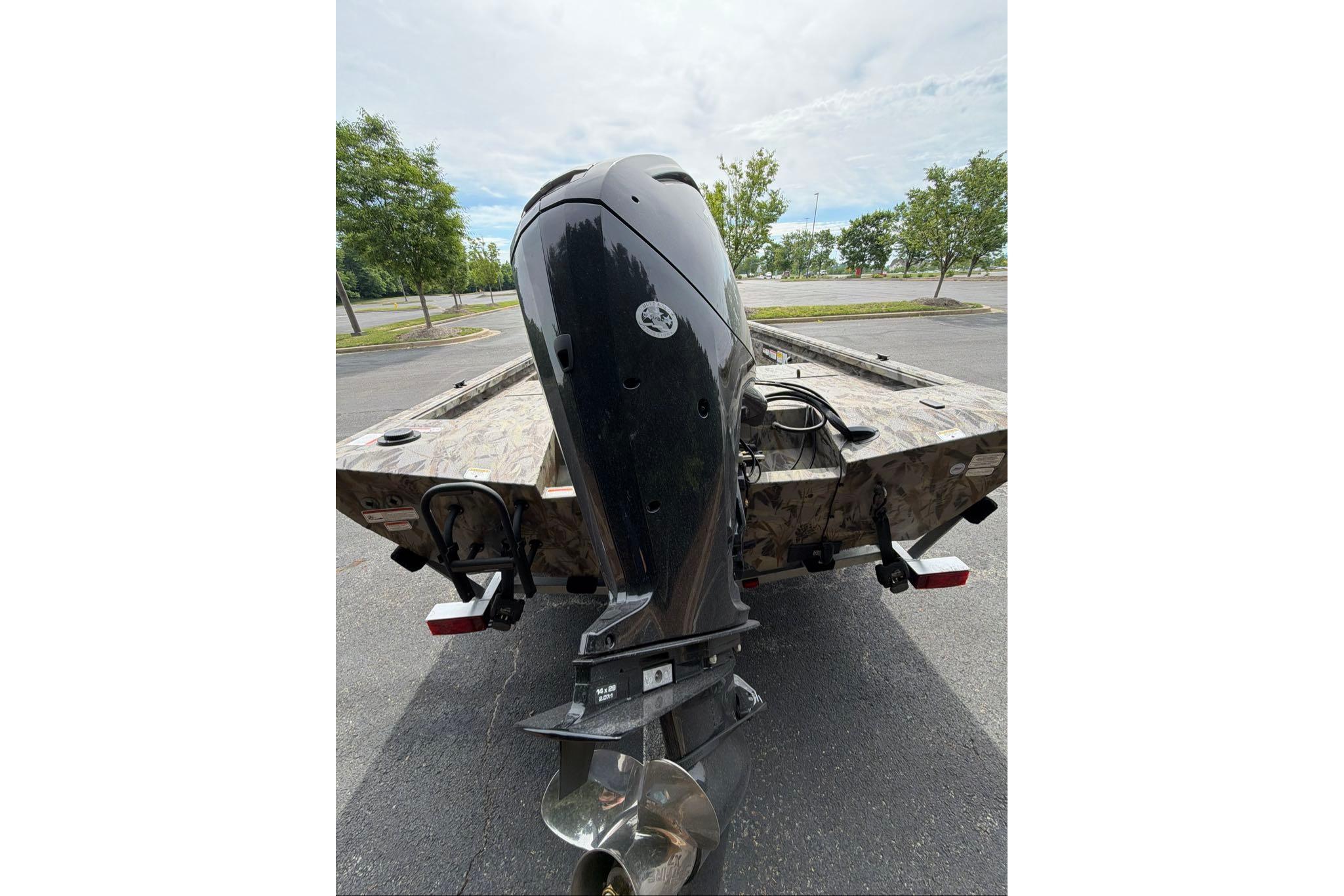 Rear view of 2026 Ranger RB190 boat with powerful outboard motor.