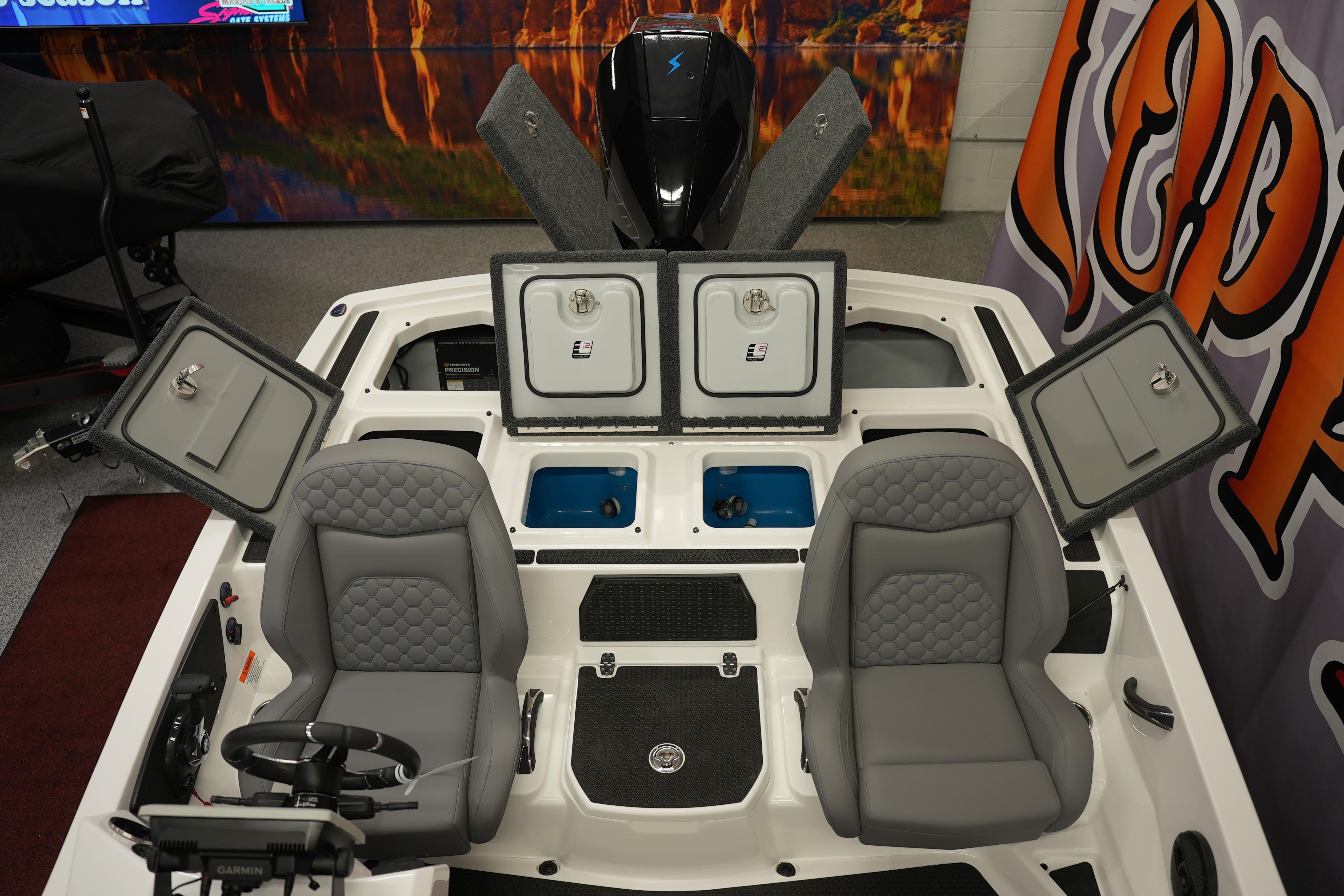 2026 iKon VLE21 boat interior with open storage compartments and two gray seats.