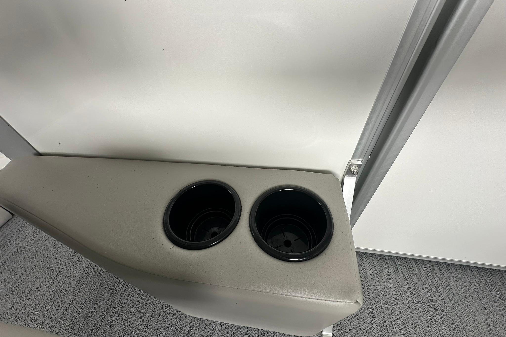 Cup holders in a 2026 Sweetwater EX2086S boat interior.