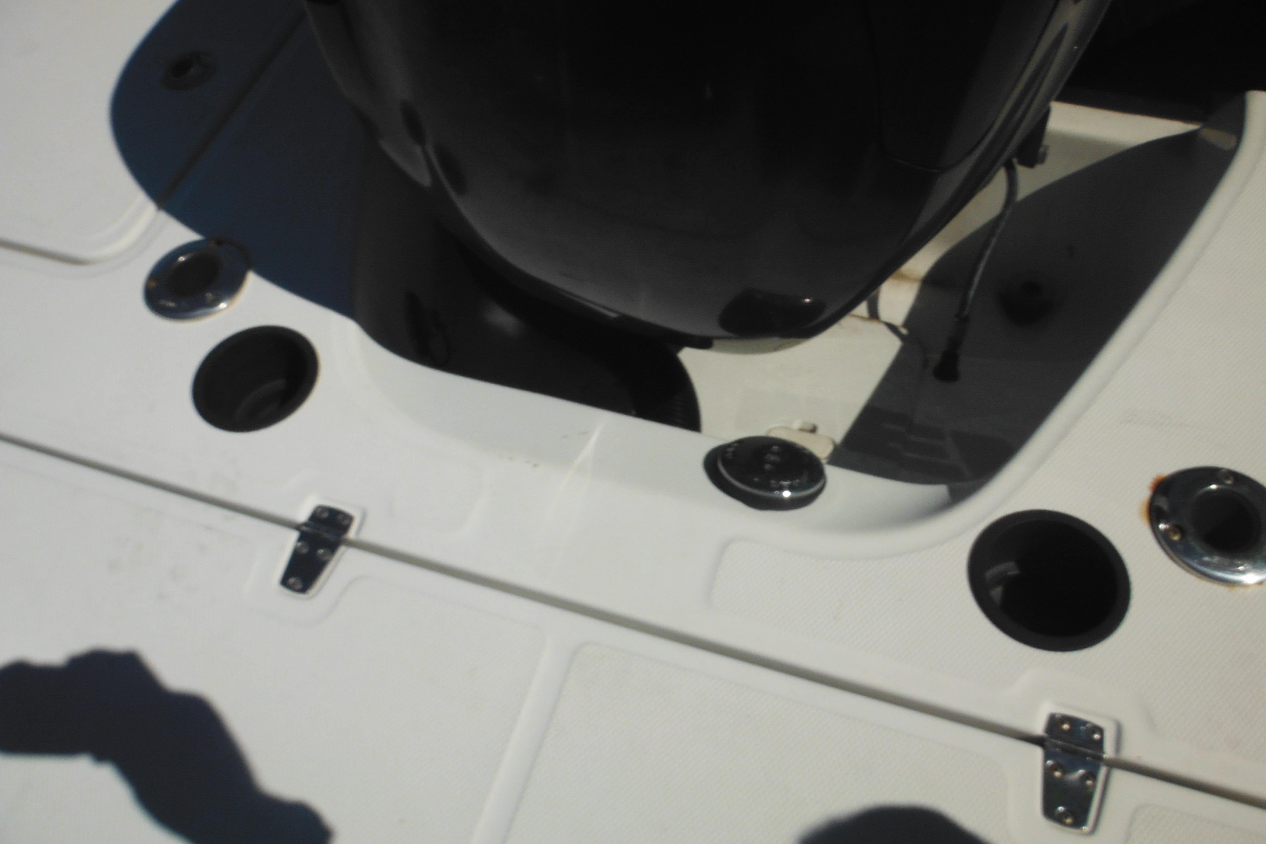 2009 Boston Whaler 200 Dauntless boat deck with motor and fittings.