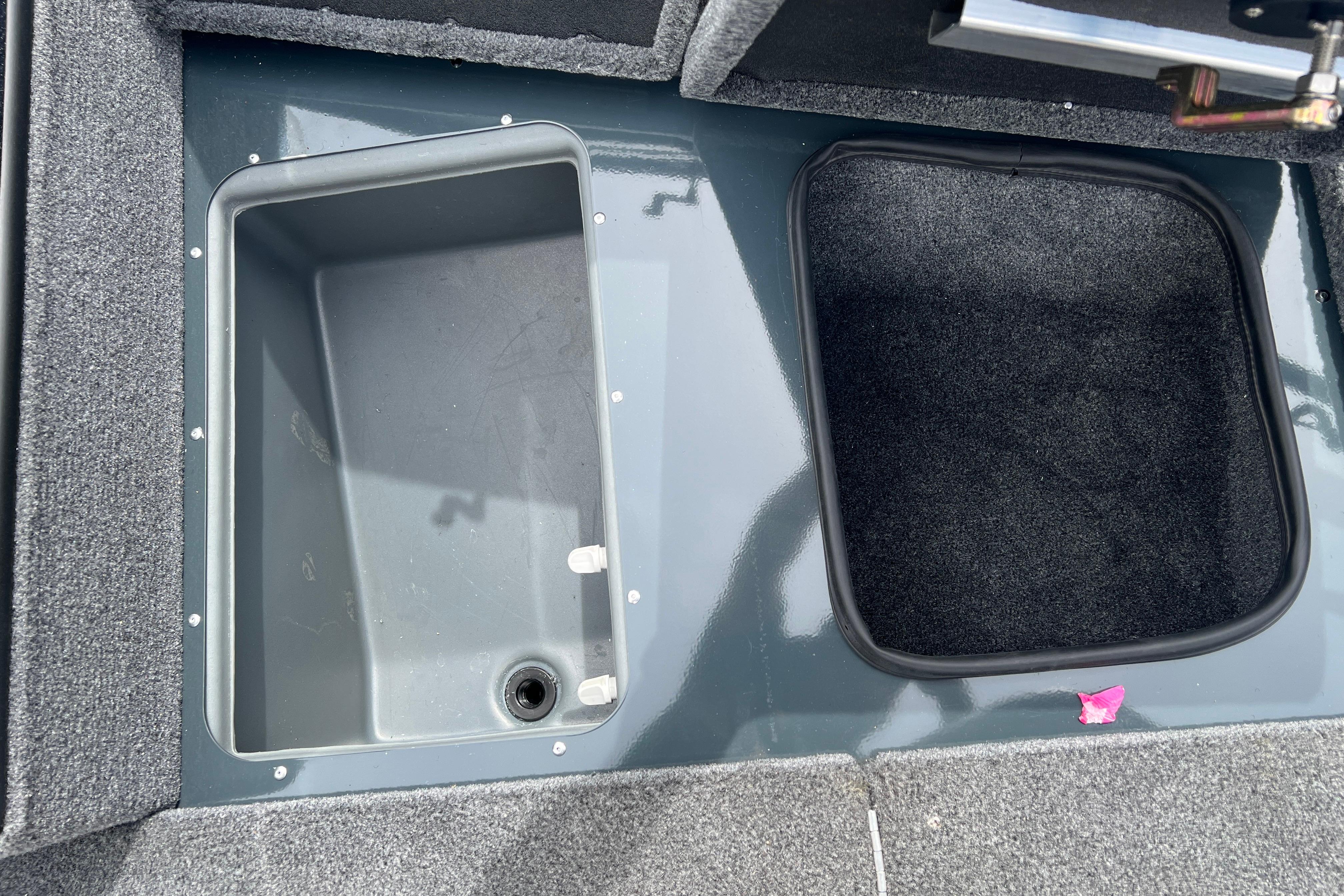 Storage compartments in 2026 Ranger VS1682SC Angler boat, featuring carpeted and non-carpeted sections.