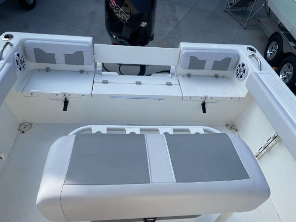 2024 Mako 214 CC boat interior with seating and storage compartments.