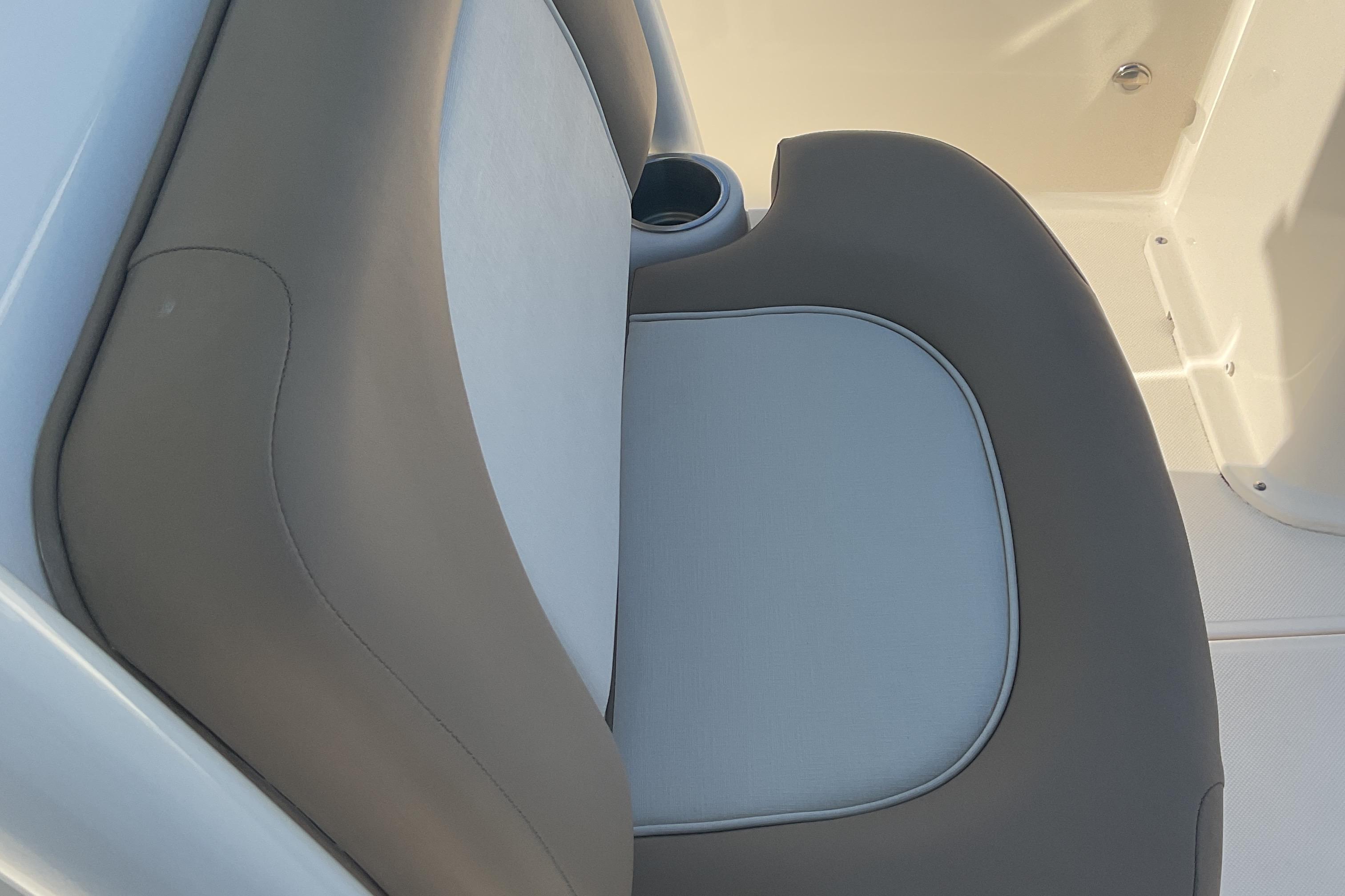 2023 Sea Born SX239 Offshore boat seat with cup holder, featuring gray and white upholstery.