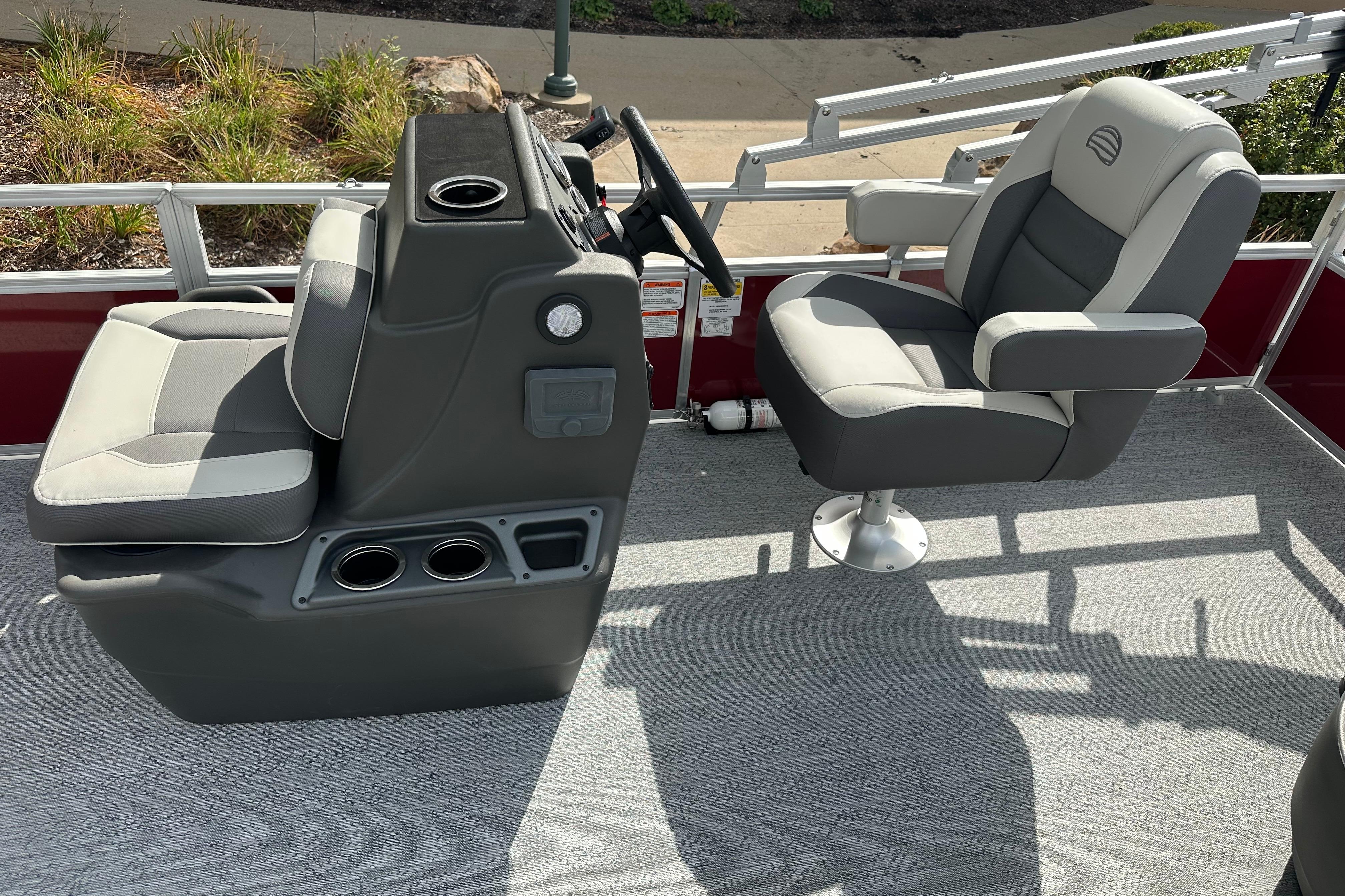 2026 Sun Tracker Bass Buggy 18 DLX boat interior with steering console and seating.