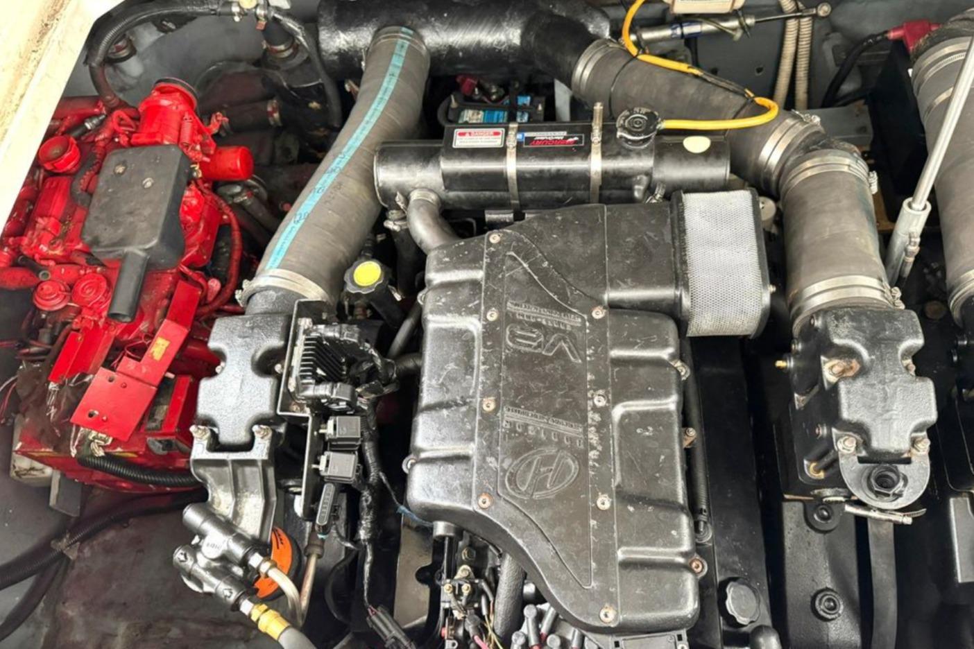 Engine compartment of a 2000 Sea Ray 340 Sundancer boat, showcasing mechanical components.