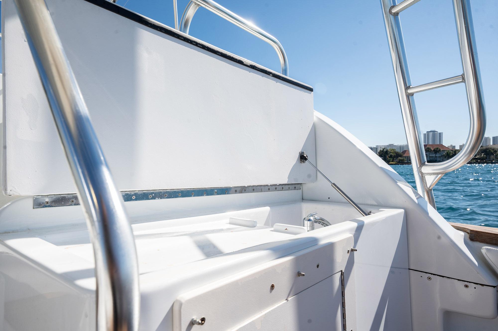 1997 Strike 42 Express boat deck with stainless steel railings and ocean view.