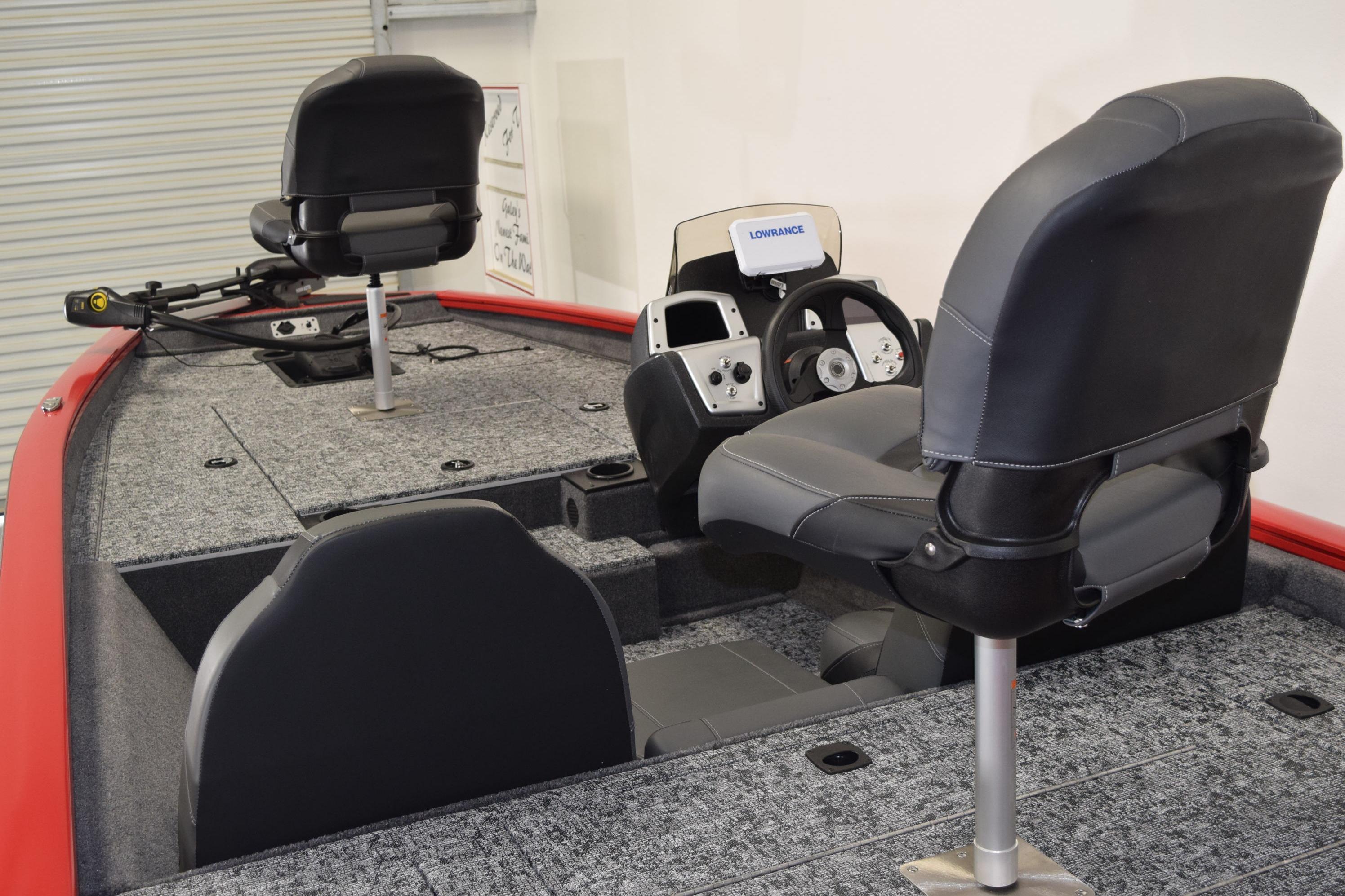 2026 Tracker Pro Team 175 boat interior with steering console and seating.