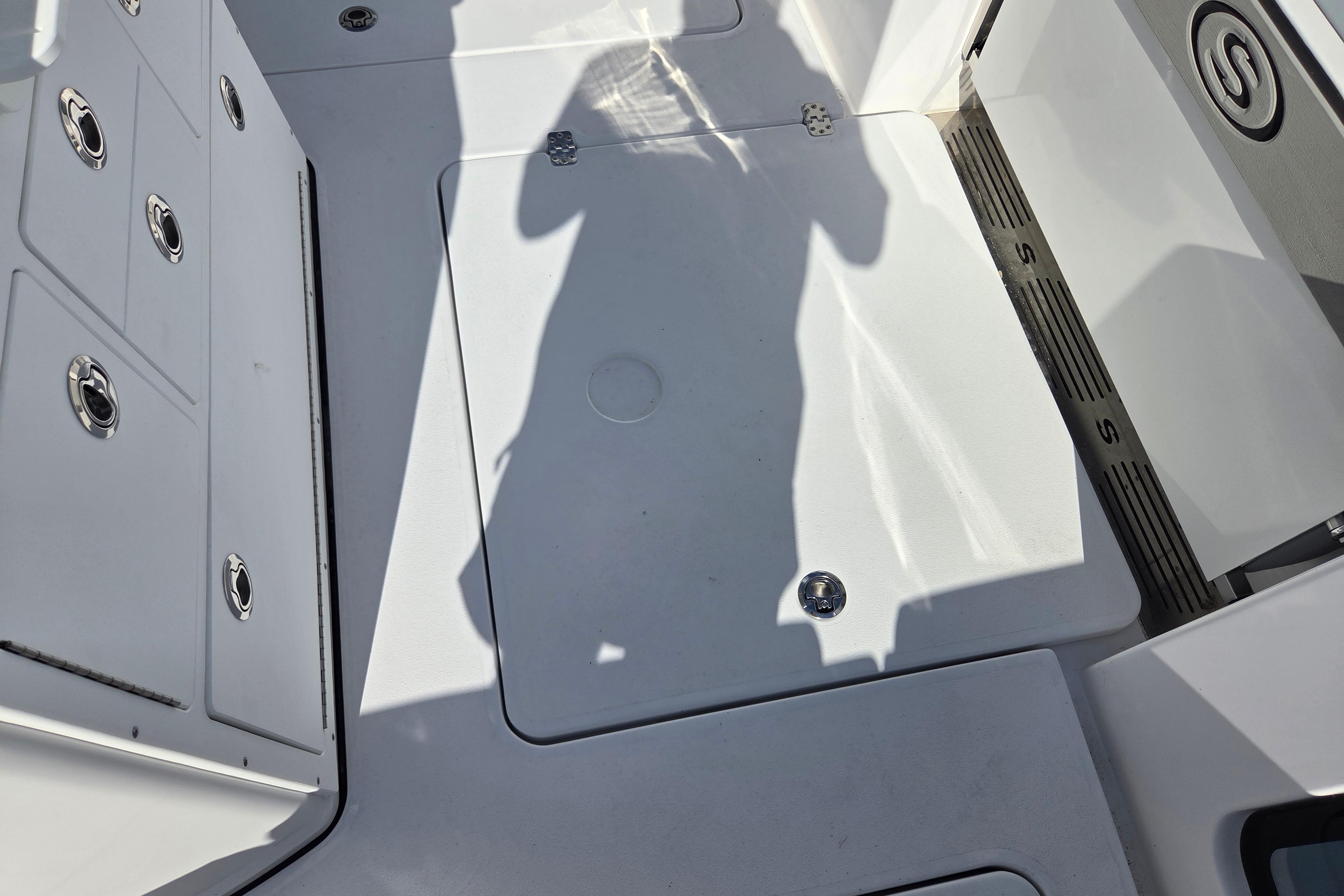 2026 Sportsman Open 282 Center Console deck with storage compartments and sleek design.