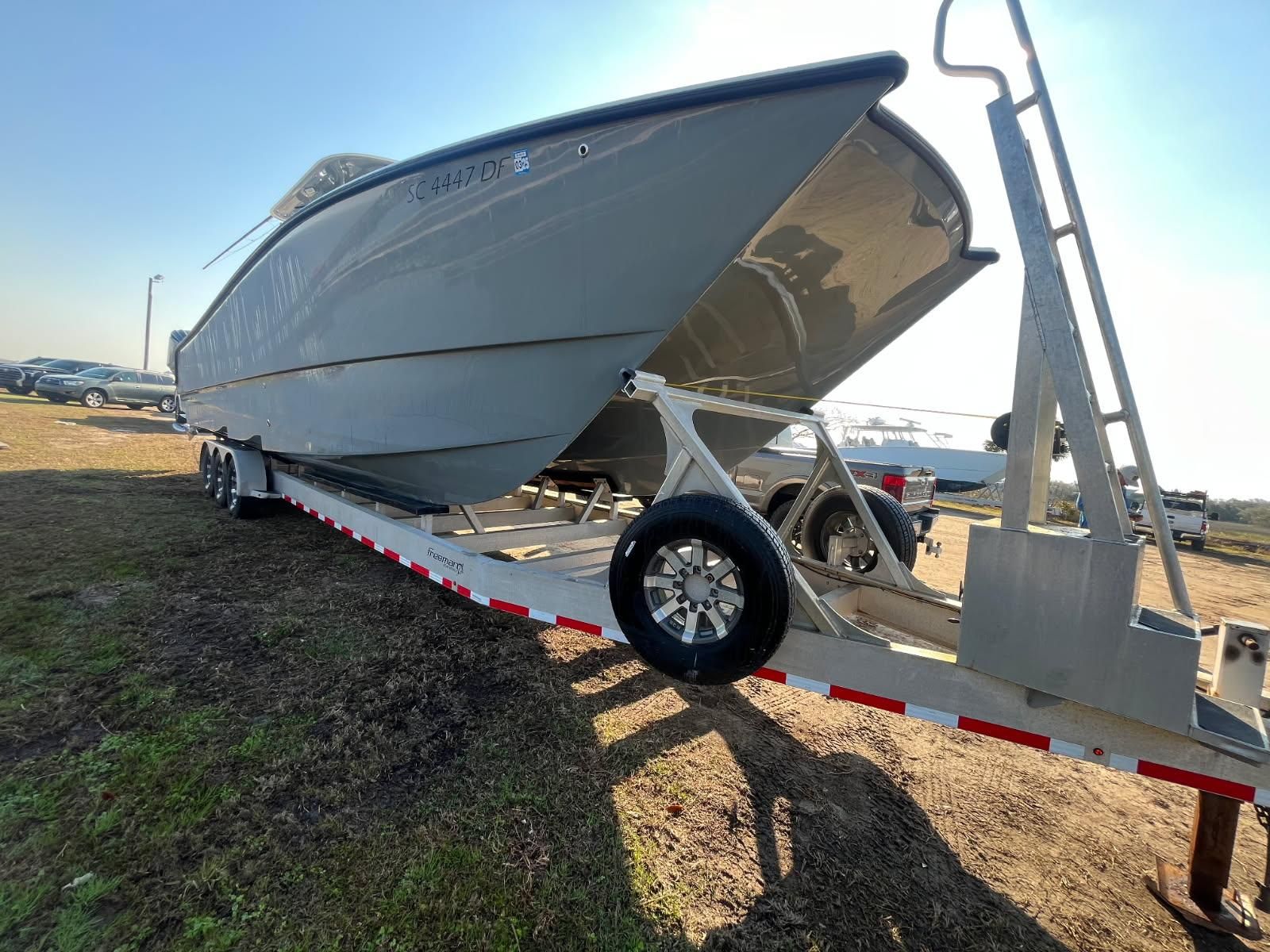 Freeman 37VH boat on trailer, 2017 model, side view.