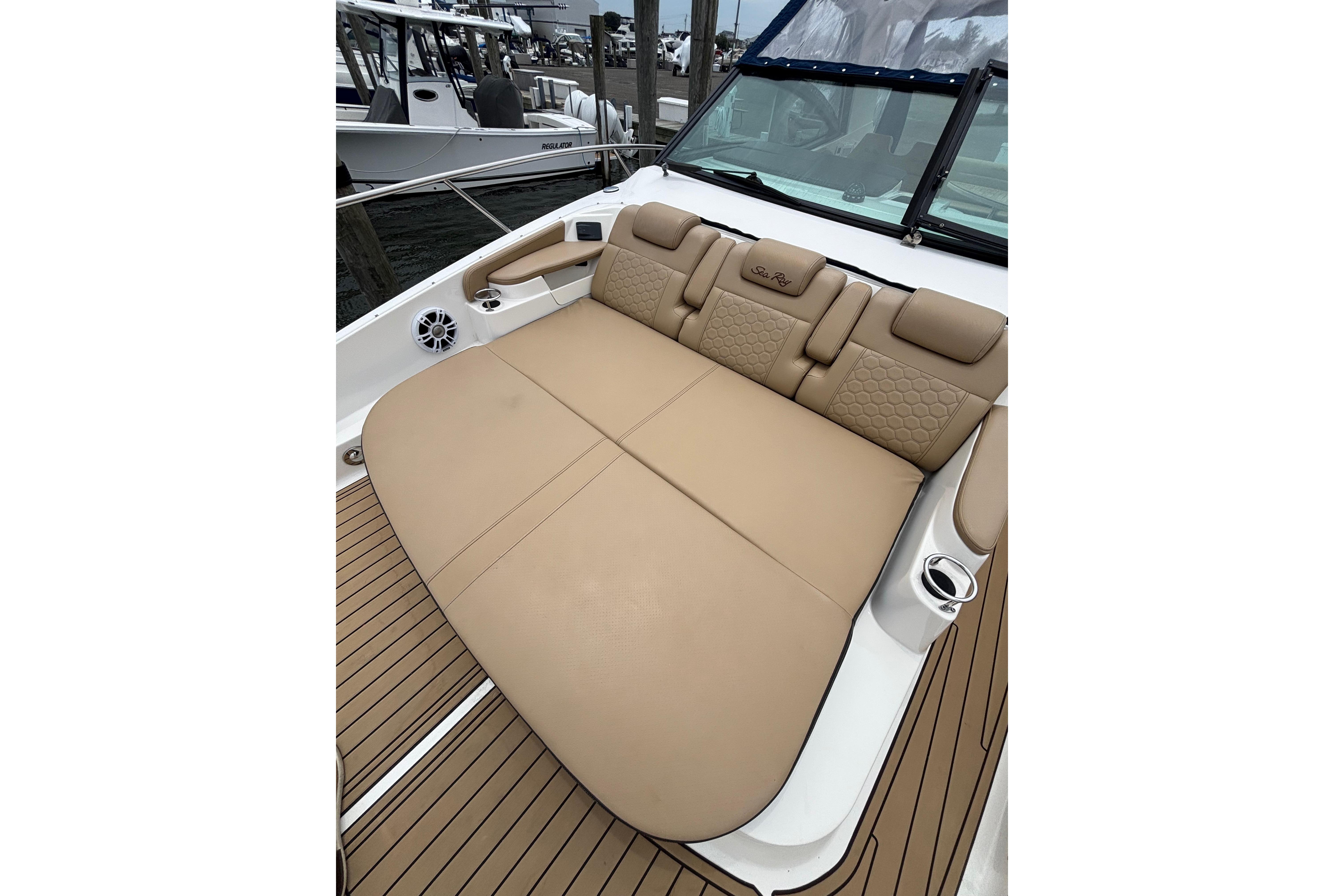2021 Sea Ray Sundancer 320 Outboard with luxurious tan seating and sleek design.