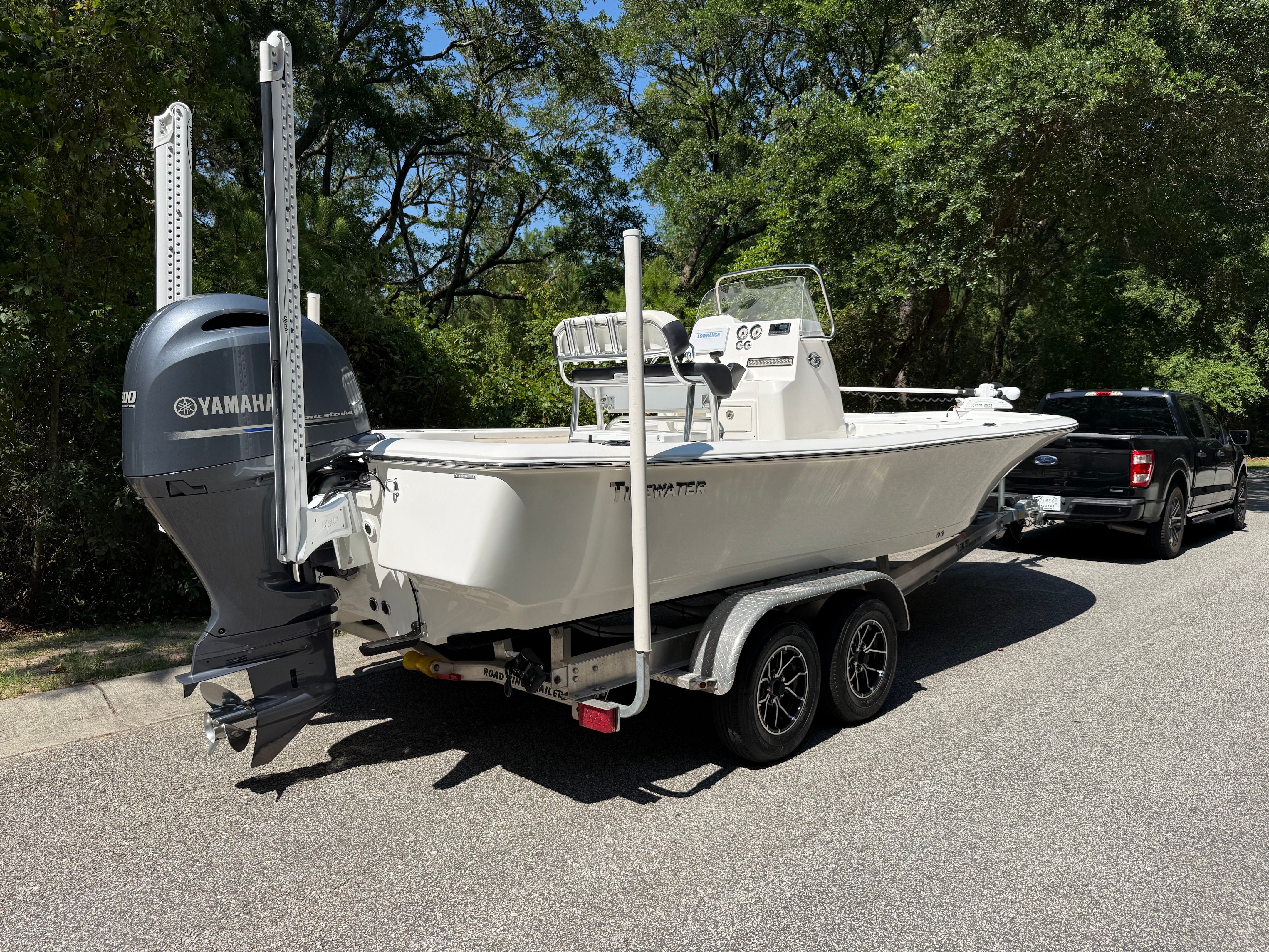 A 2023 Tidewater 2210 Carolina Bay boat on a trailer, ready for transport.