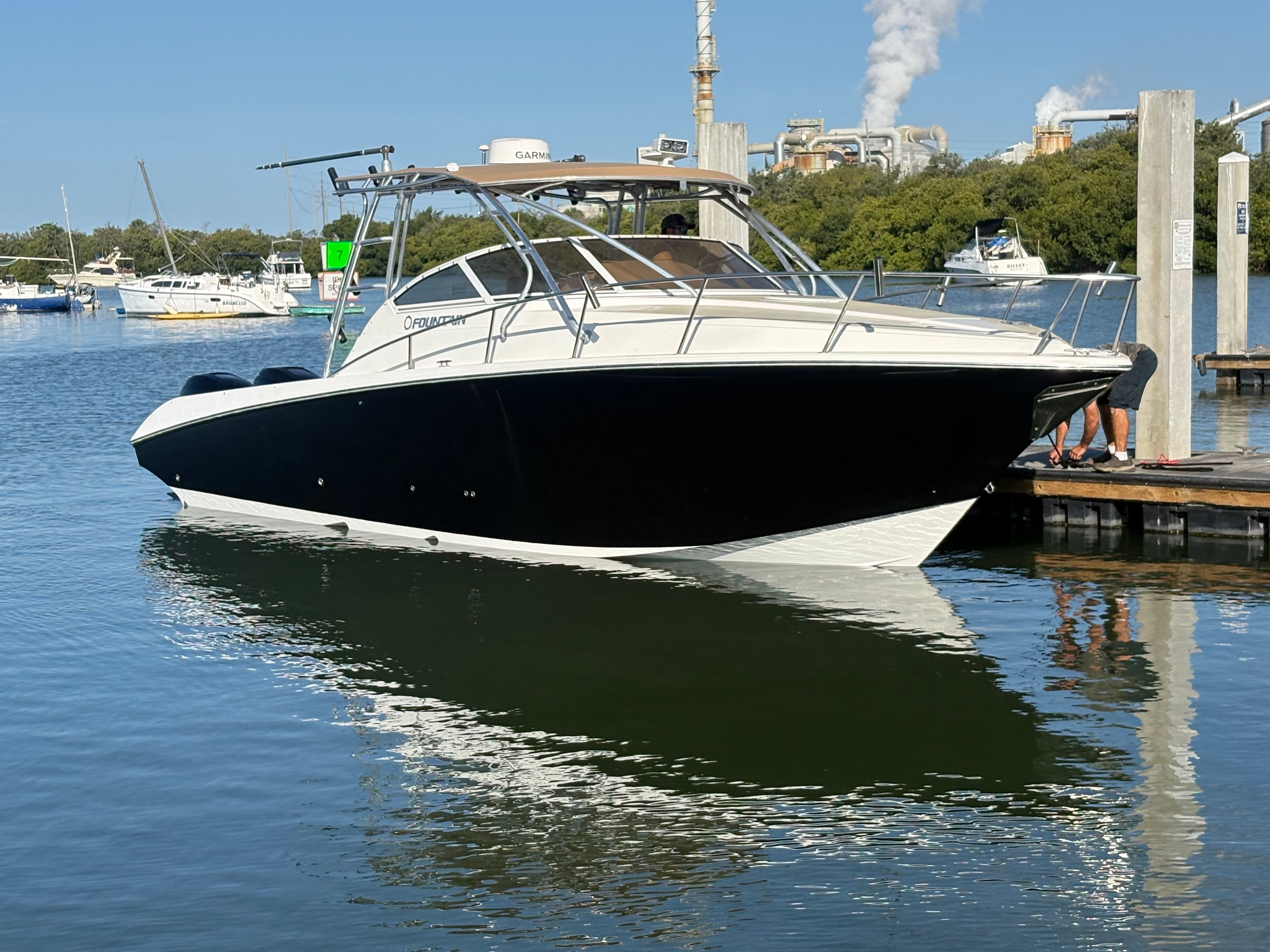 2009 Fountain 33 Sportfish Cruiser docked on the water.