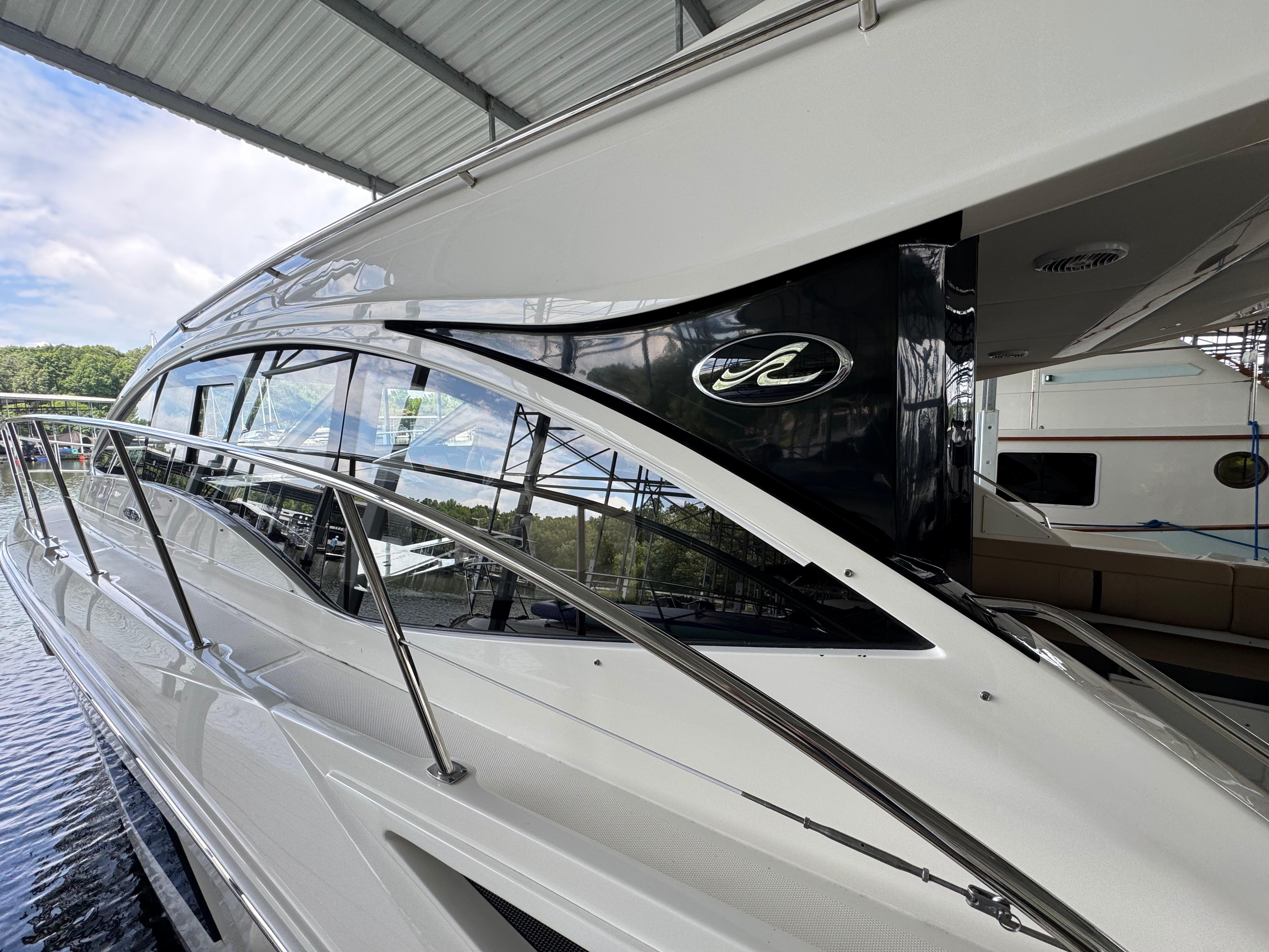 2017 Sea Ray Sundancer 400 yacht docked under a covered marina.
