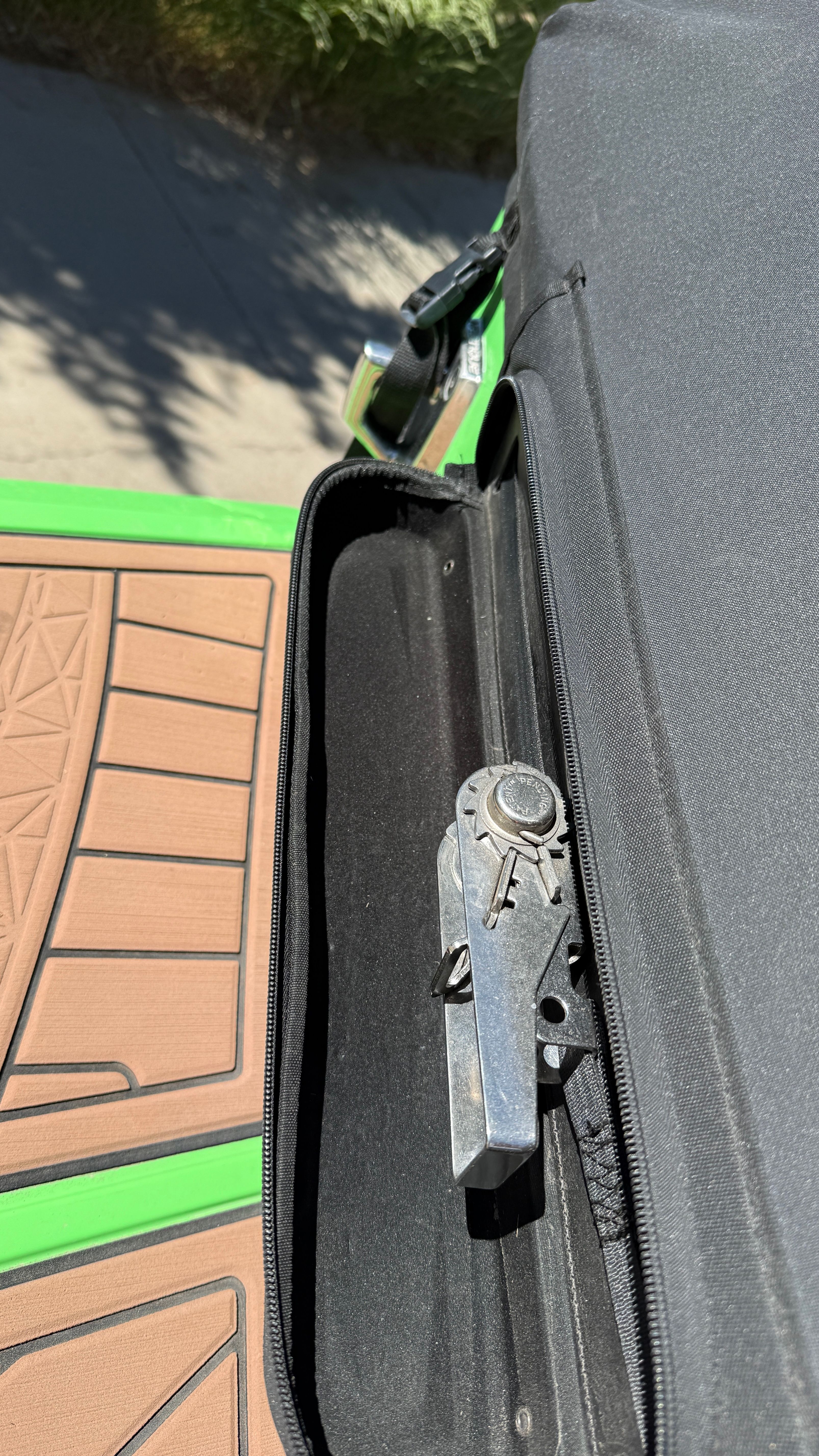 Close-up of a boat part with green and brown design.