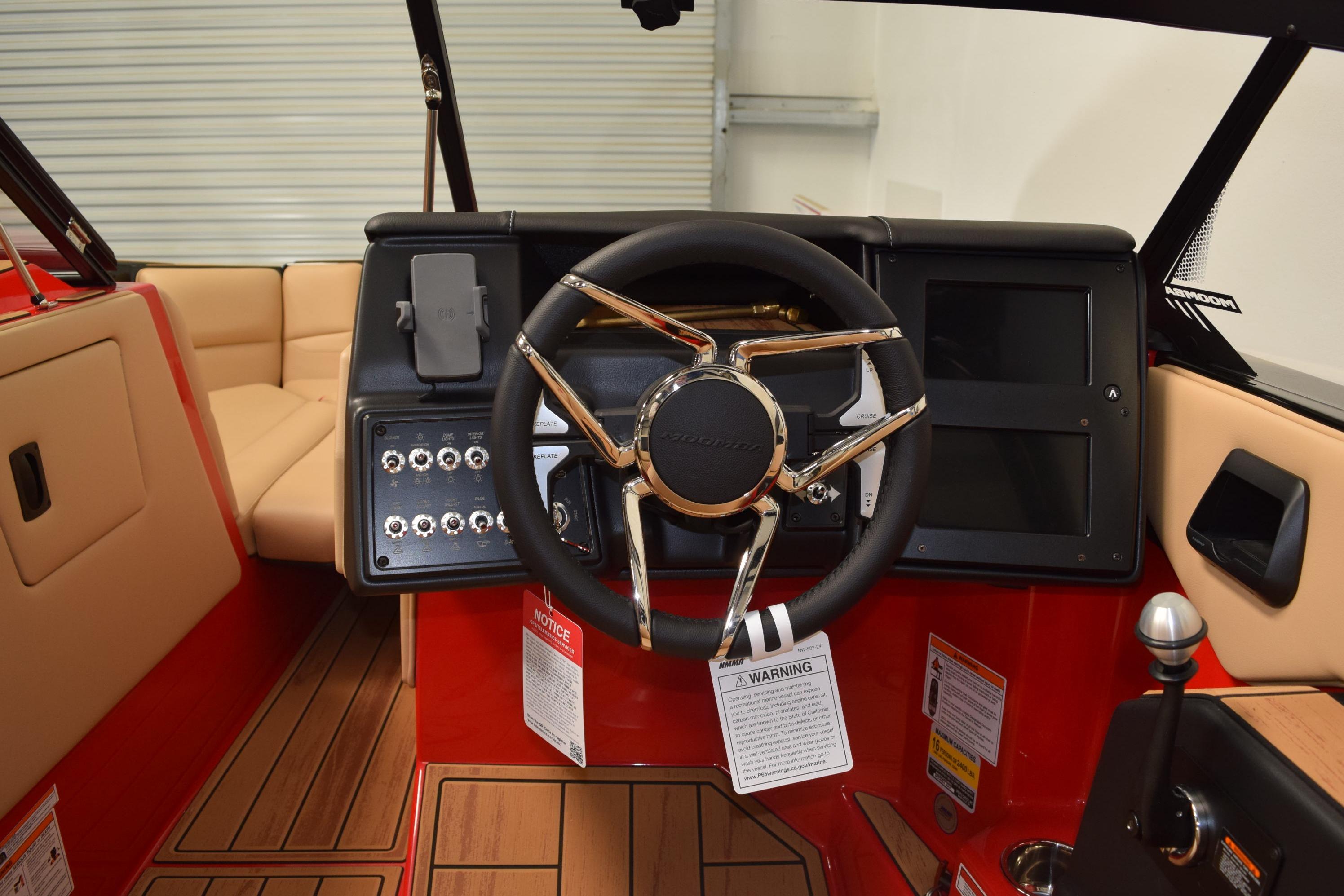 2026 Moomba Max boat interior with steering wheel and control panel.