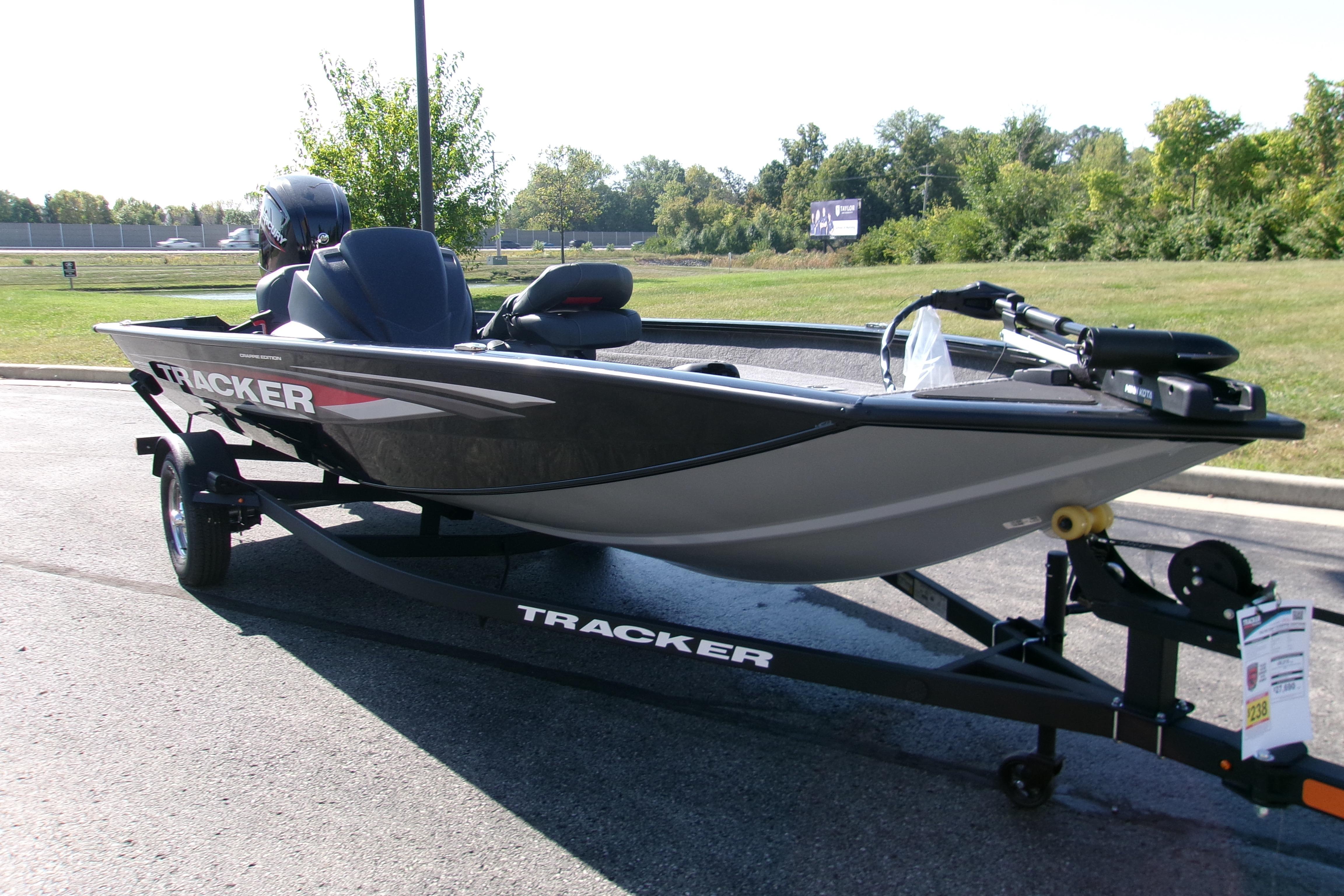 2026 Tracker Pro Team 175 Crappie Edition boat on trailer, parked outdoors.