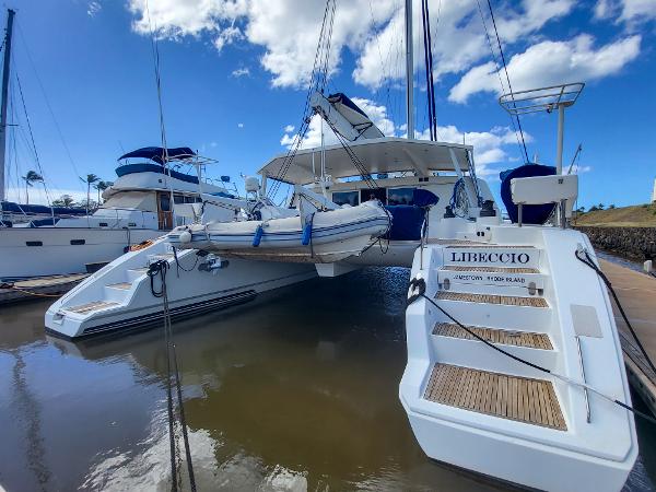 2009 Catana 65 catamaran docked with dinghy, named Libeccio.