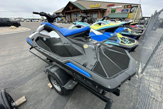 A Yamaha WaveRunner Jetblaster in black sits on a trailer outside a store.