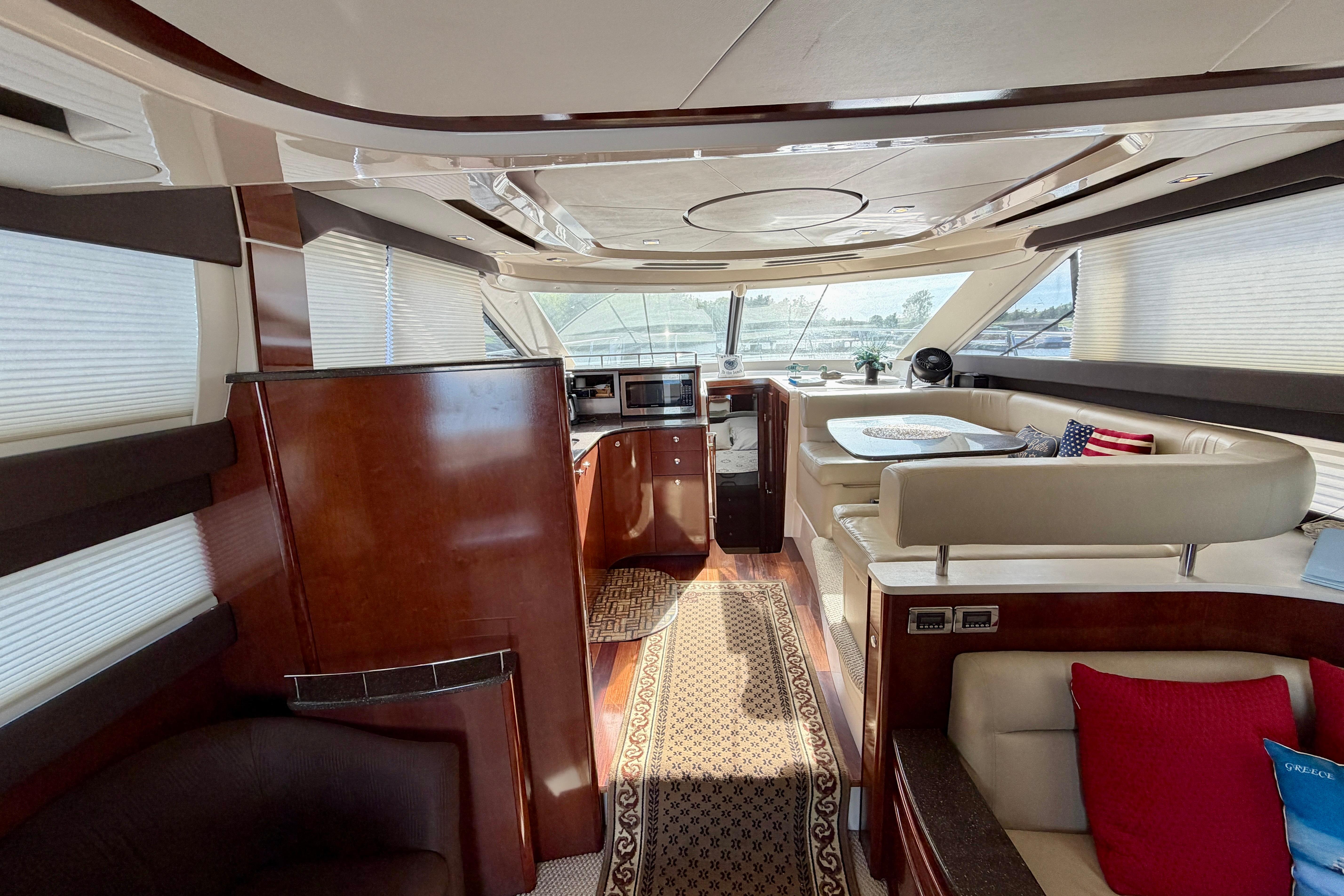 Luxurious interior of a 2011 Meridian 441 Sedan yacht with elegant wood finishes.