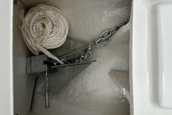Anchor and rope storage in 2024 Bayliner DX 2250 boat compartment.