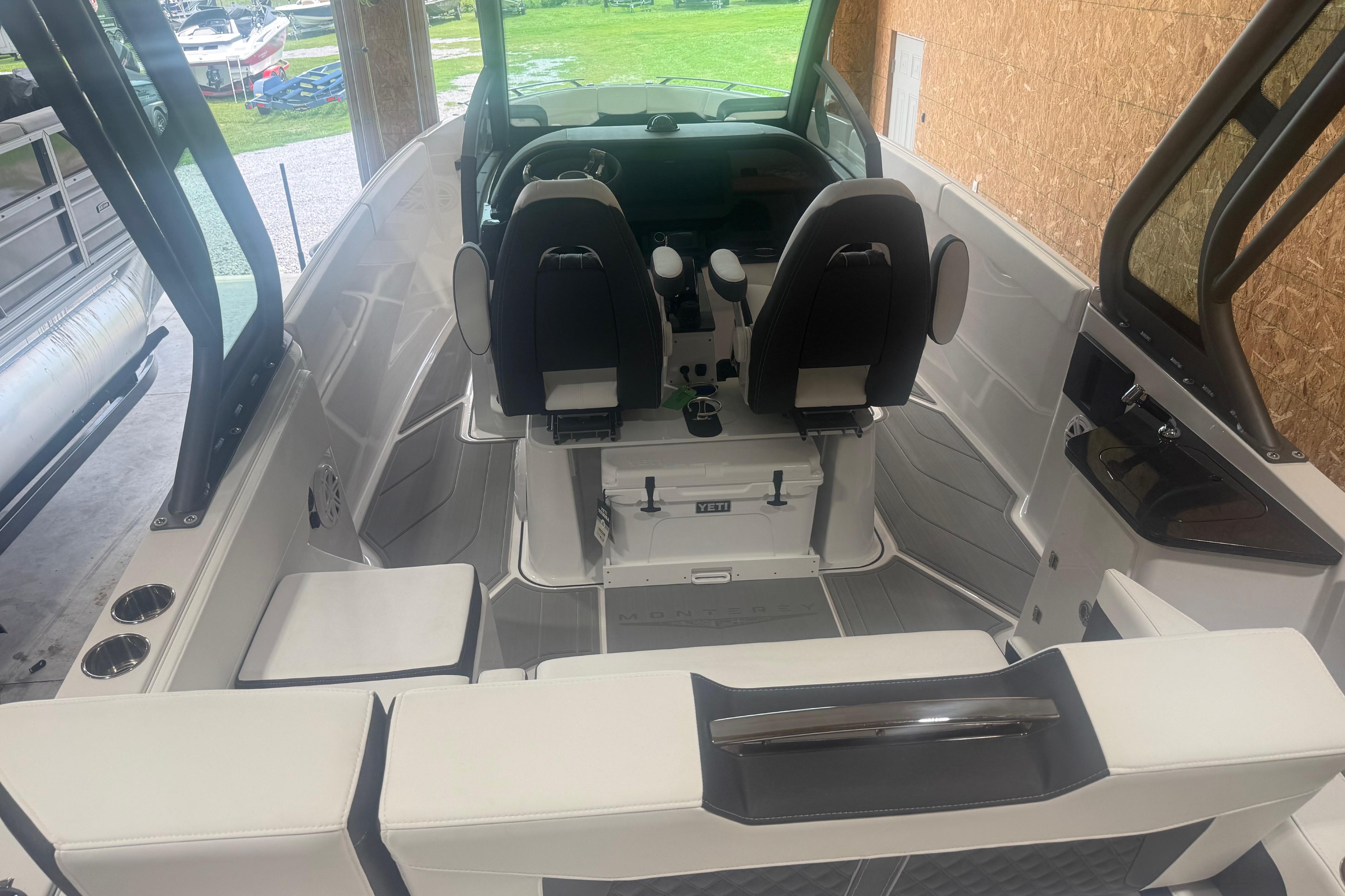 2027 Monterey Elite 27 SD boat interior with modern seating and helm controls.
