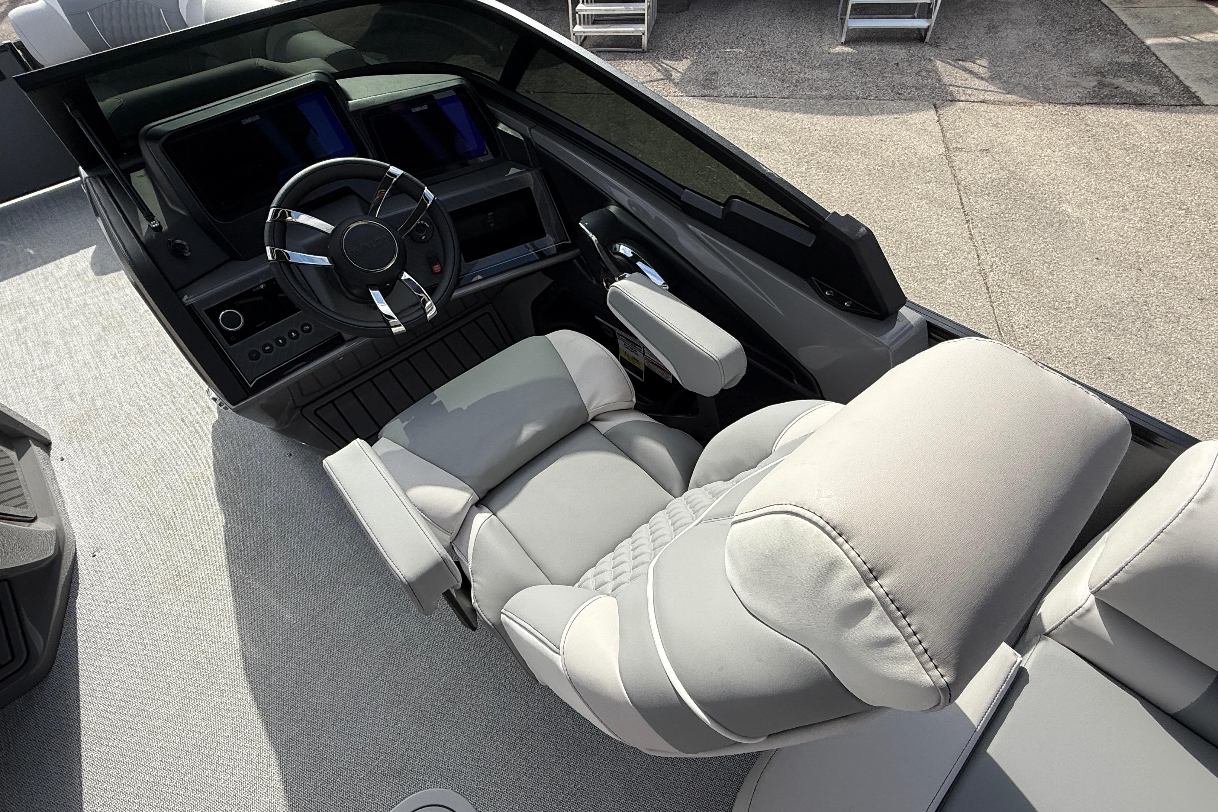 Luxurious helm of 2026 Avalon 2585 Excalibur LTD with modern controls and plush seating.