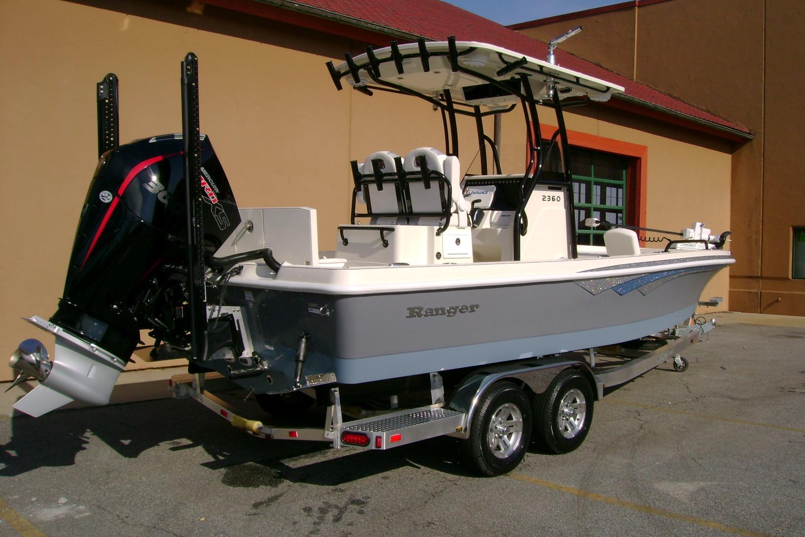 2026 Ranger 2360 Bay boat on trailer, featuring powerful outboard motor.