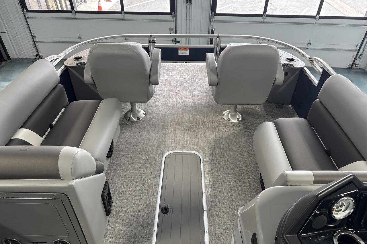 Interior of 2026 Landau Island Breeze 23F pontoon boat with gray seating and carpet.