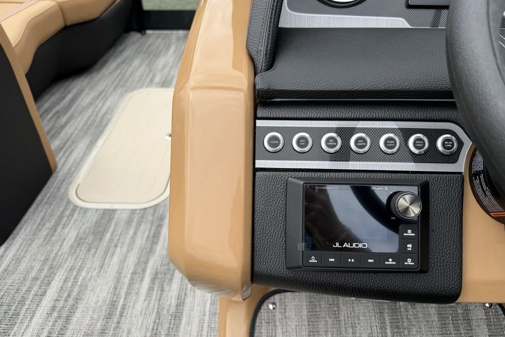 2026 Godfrey Monaco 235 SFLC iMPACT dashboard with JL Audio system and control buttons.
