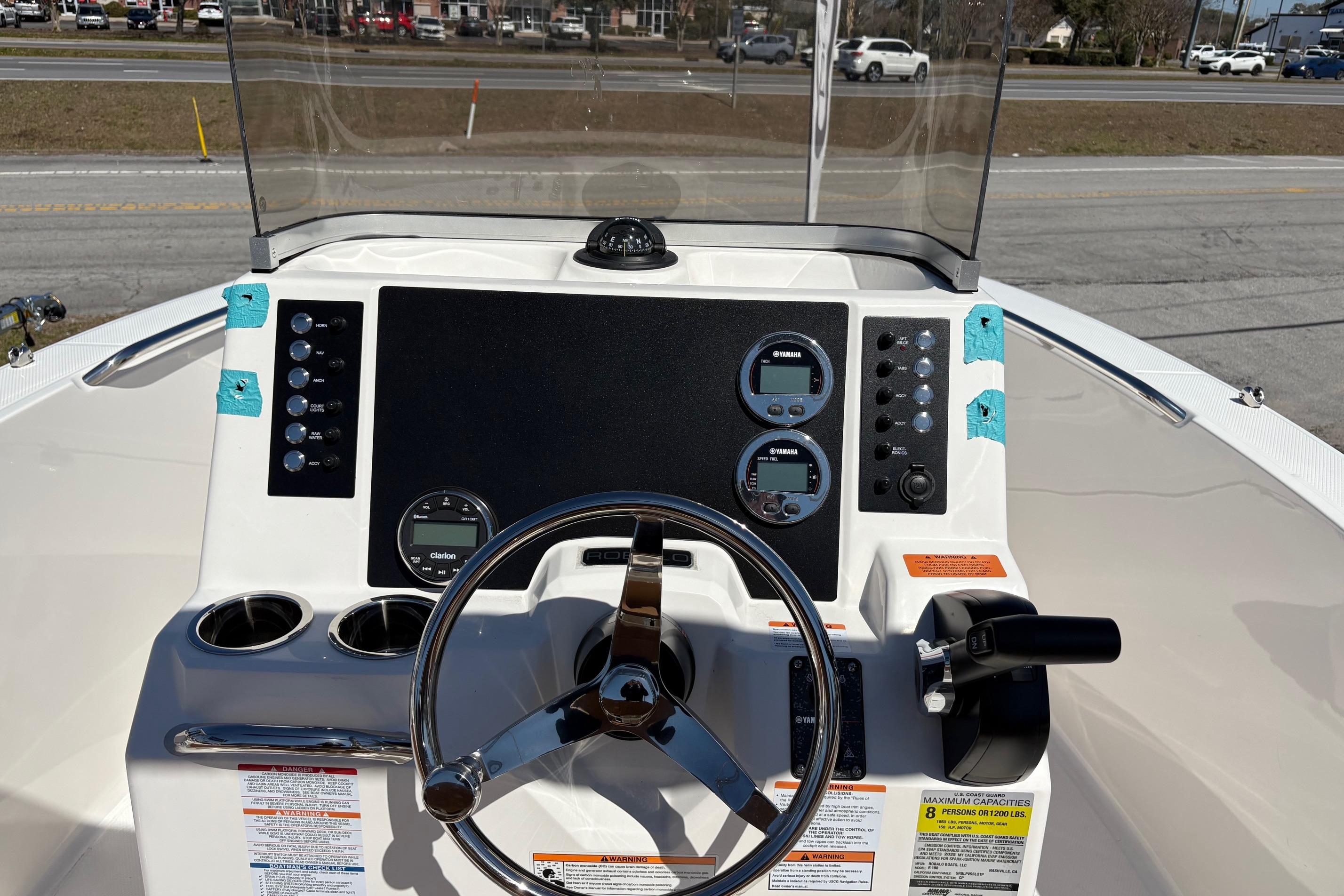 2026 Robalo R180 Center Console boat dashboard with steering wheel and controls.