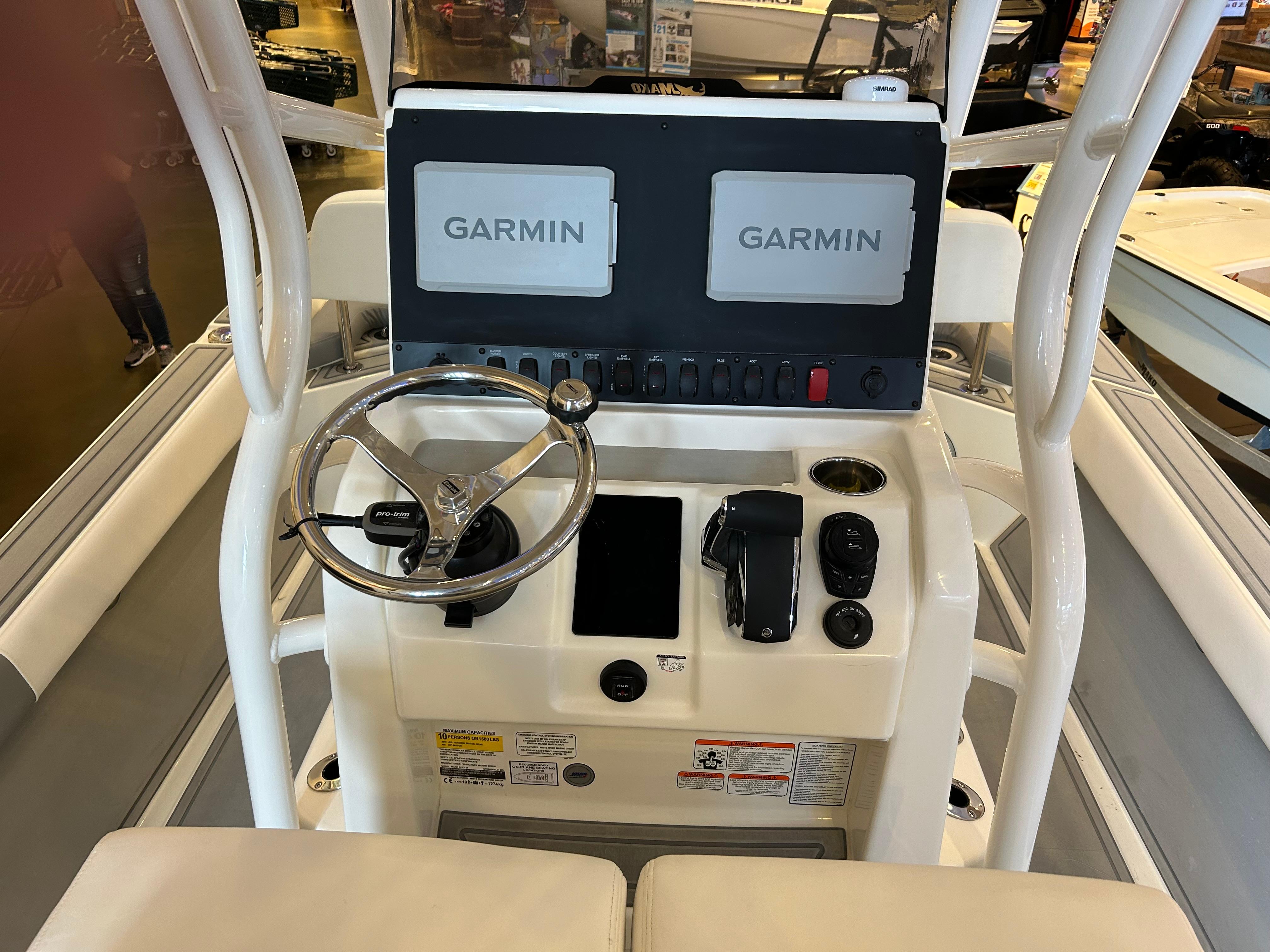 Control console of 2025 Mako 24 APEX boat with dual Garmin displays.