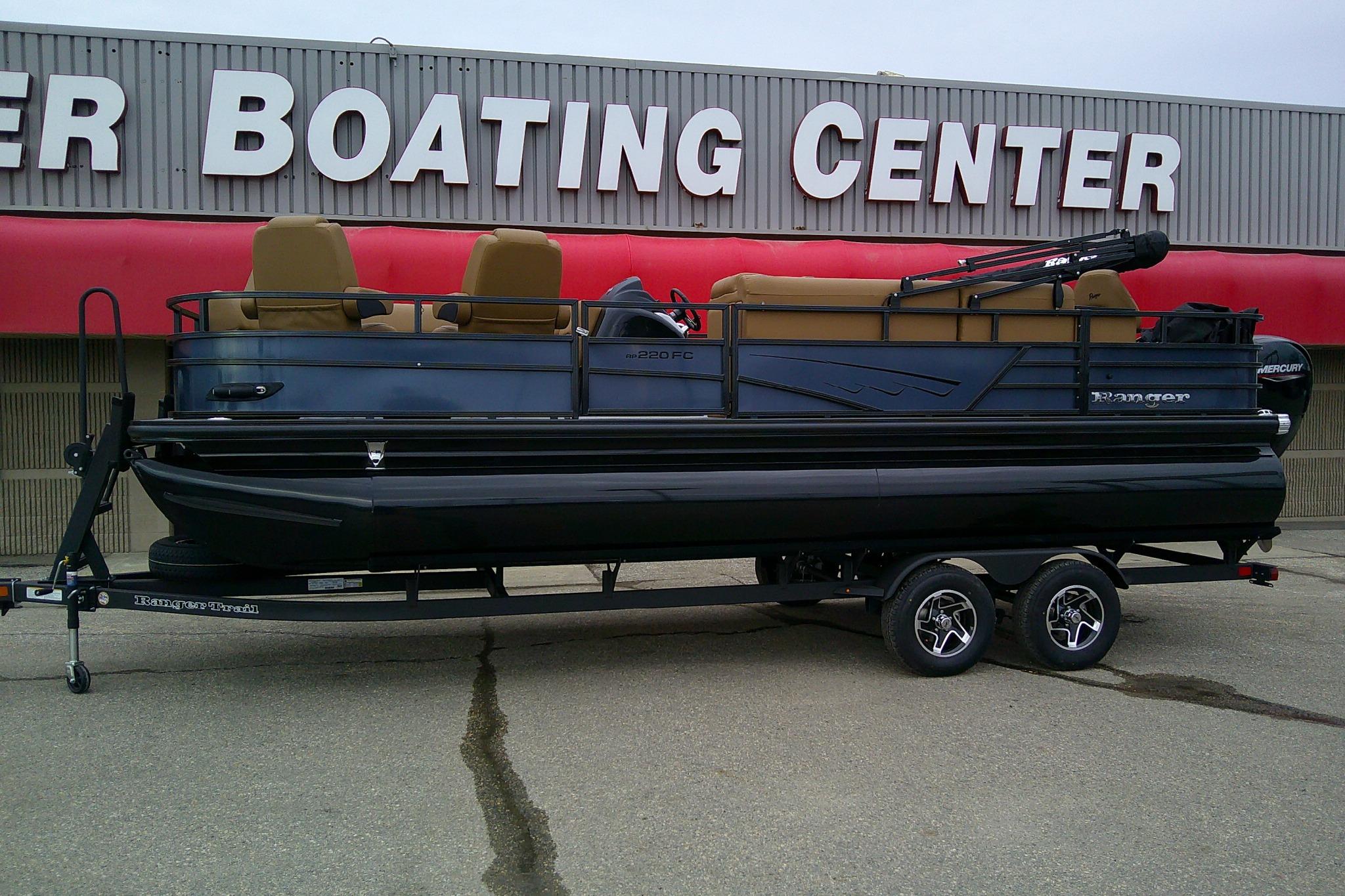 2026 Ranger 220FC pontoon boat on trailer at boating center.