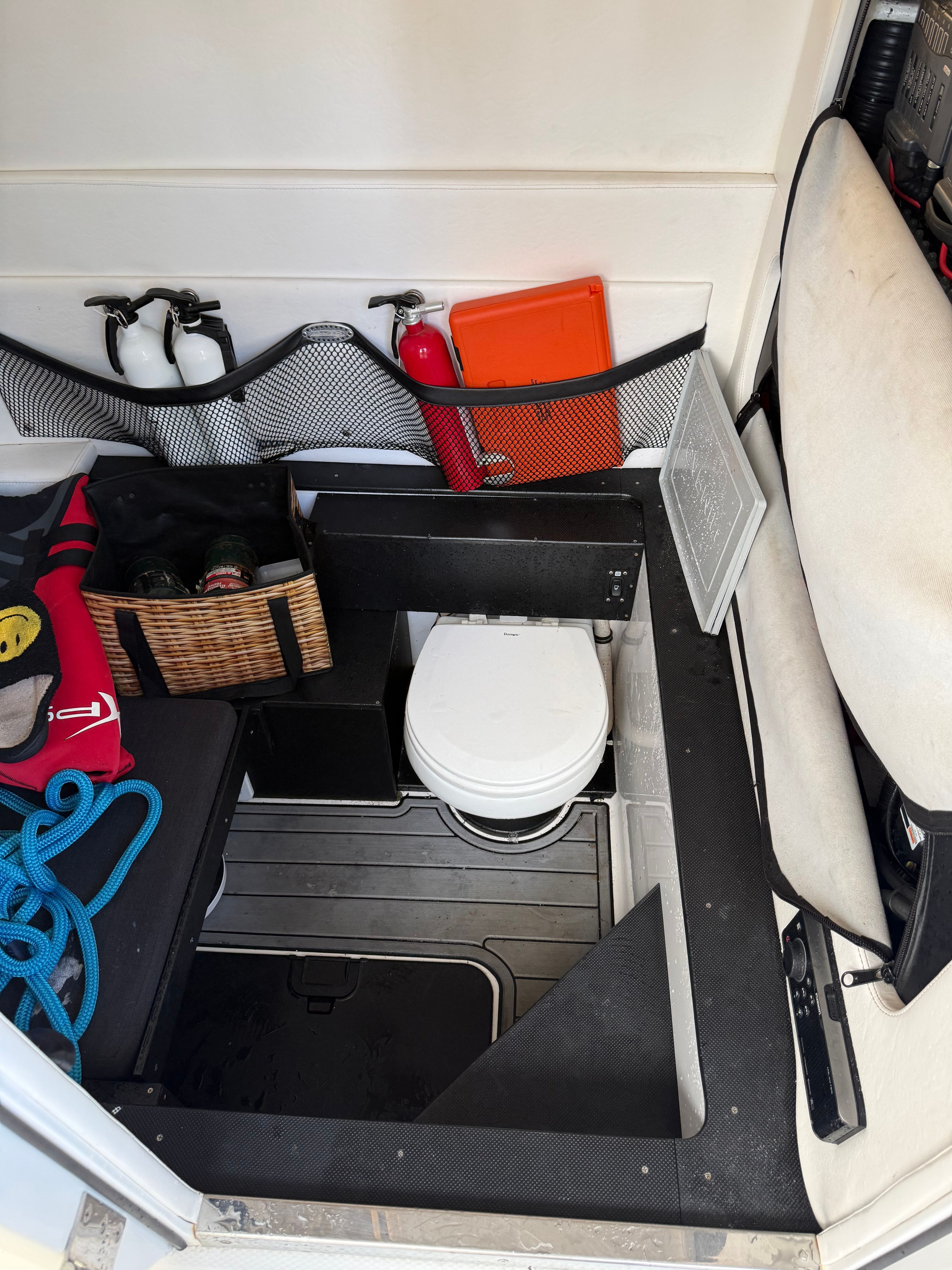Interior of a Nor-Tech 392 Super Fish boat with toilet and accessories.