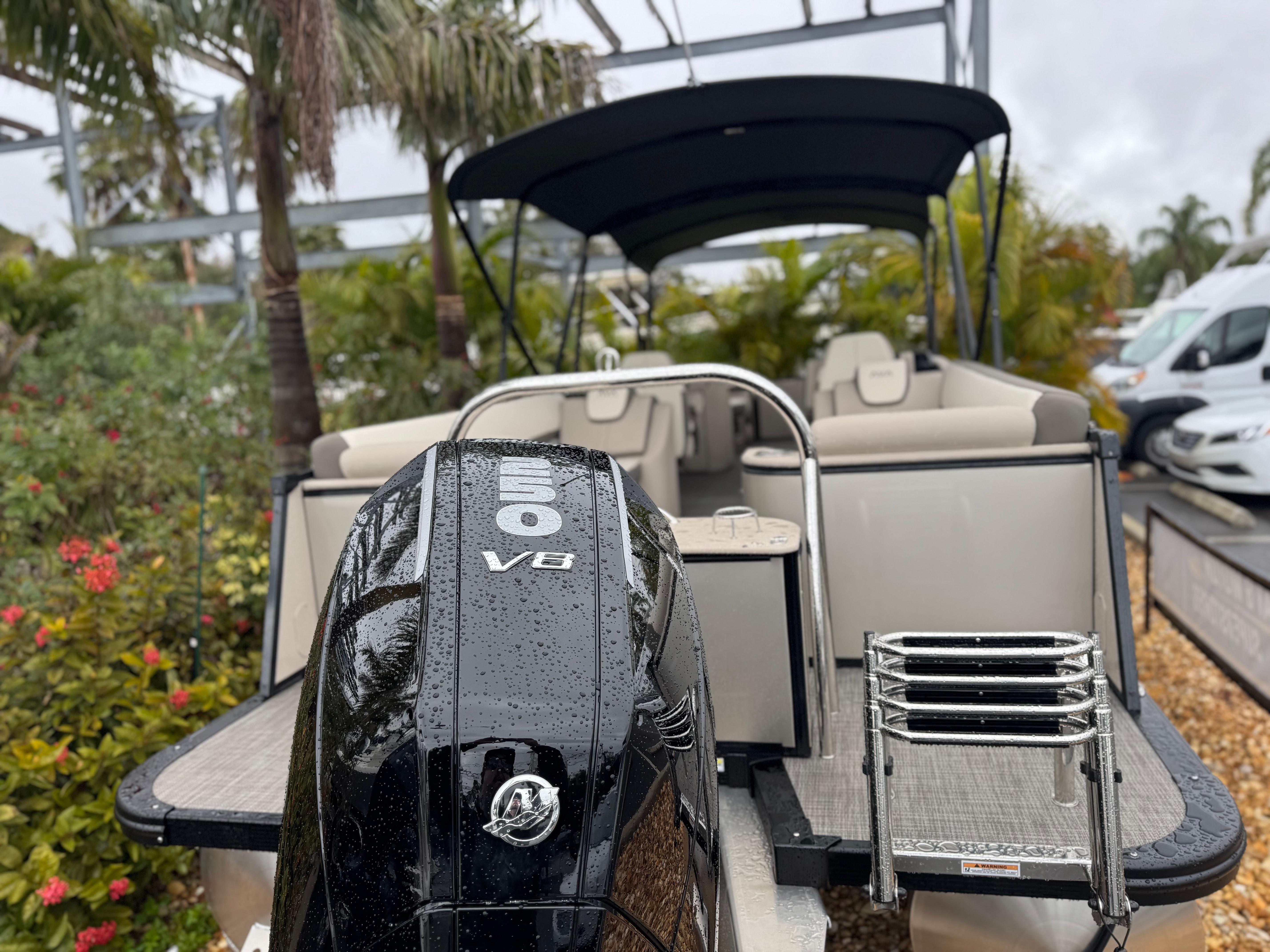 2025 Avalon Catalina Quad Lounge boat with powerful V8 engine, parked outdoors.