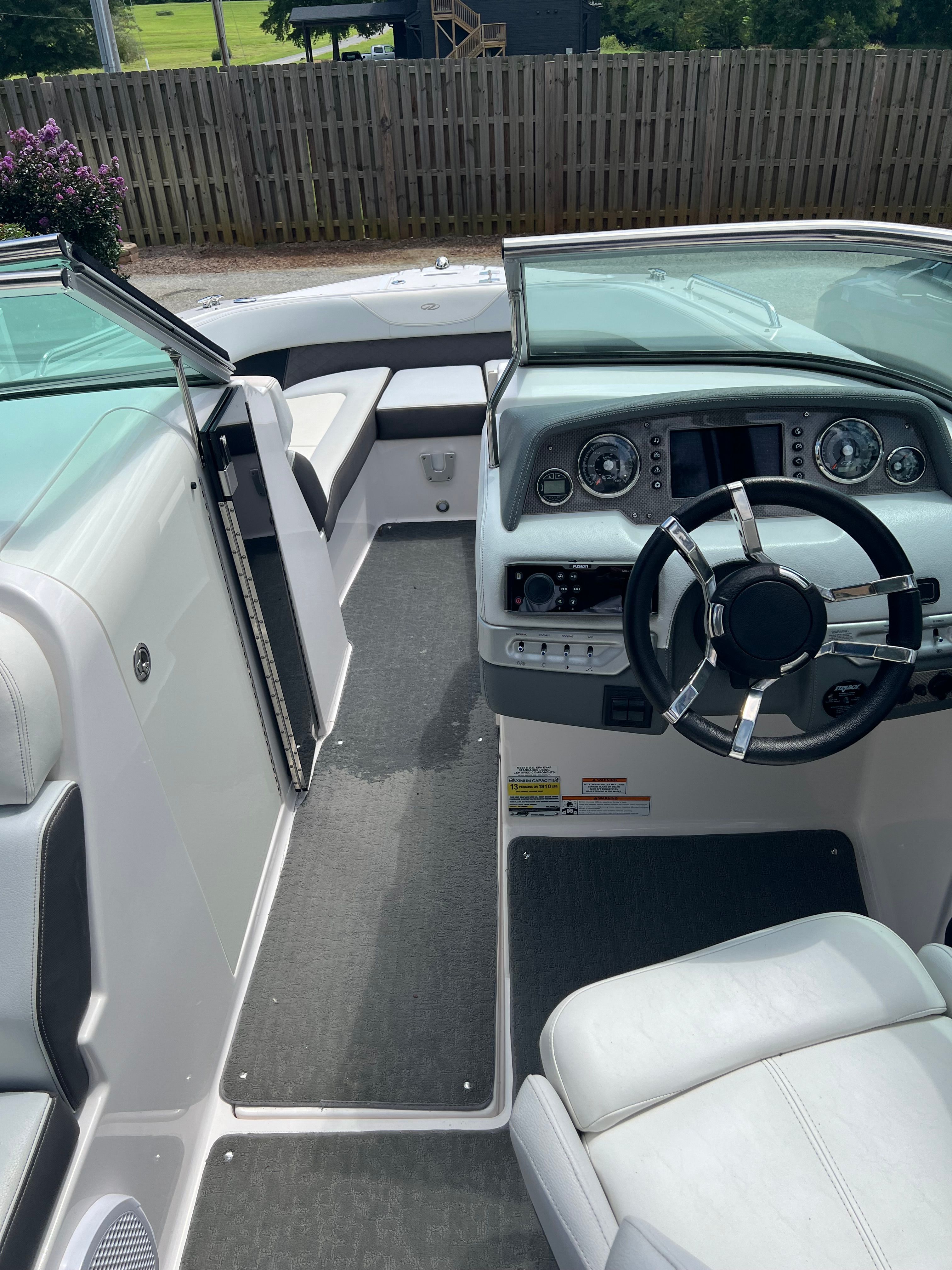 Interior of a 2014 Regal 24 FasDeck RX boat with steering console.