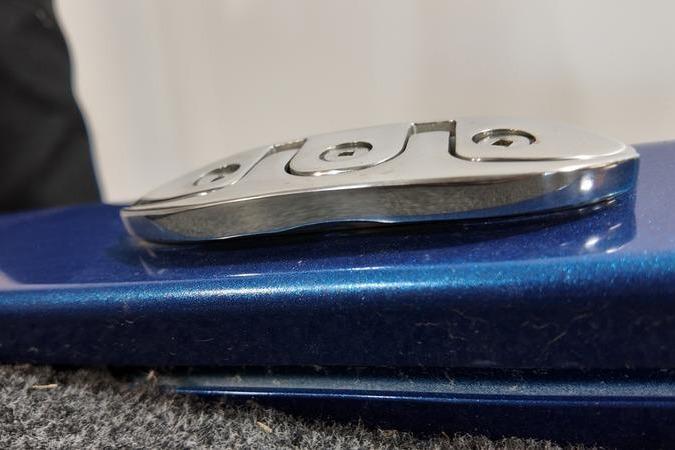 2024 Lowe Stinger 198 boat cleat on blue surface, close-up view.