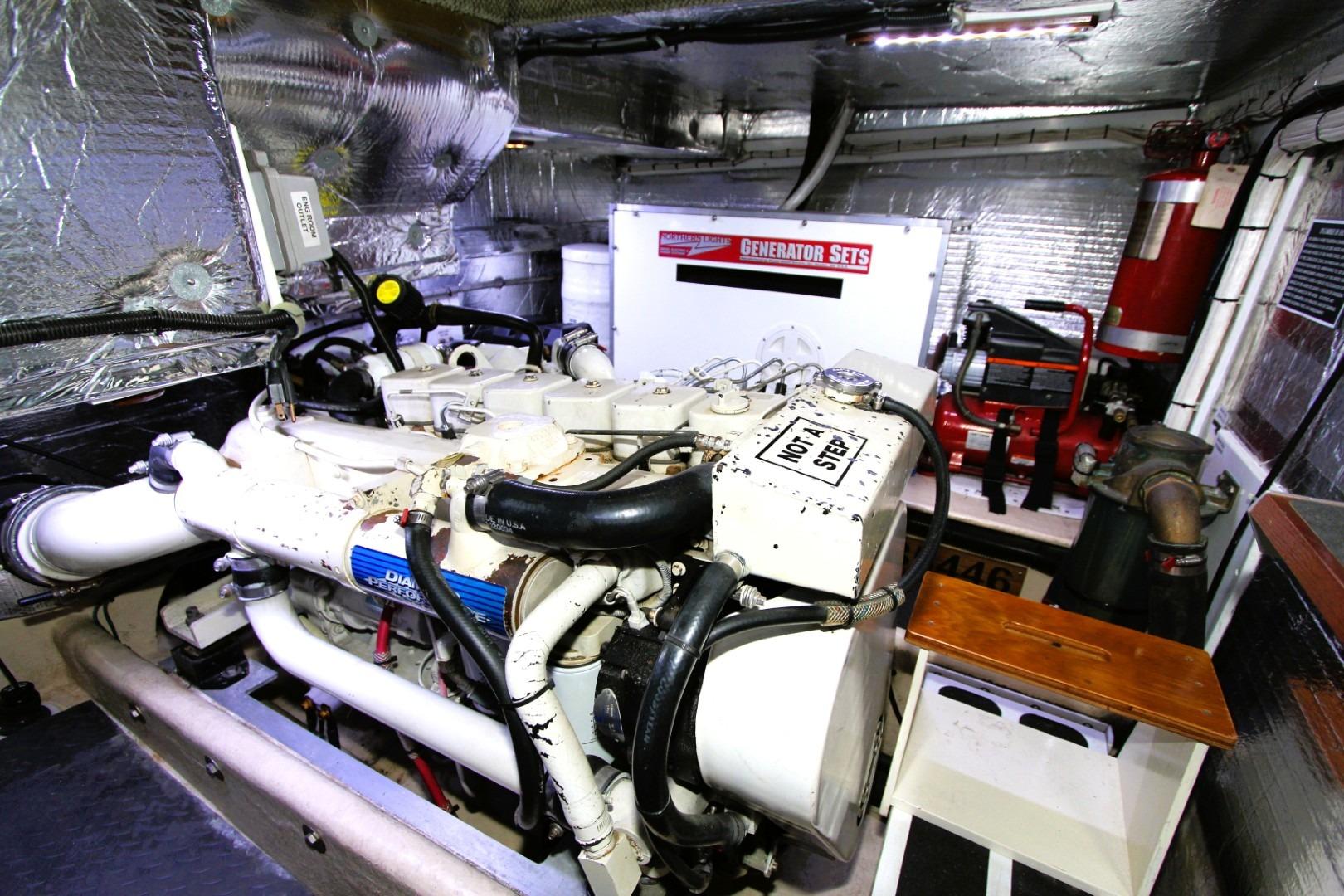 Engine room of a 2002 Nordic Tug 37 with generator and equipment.