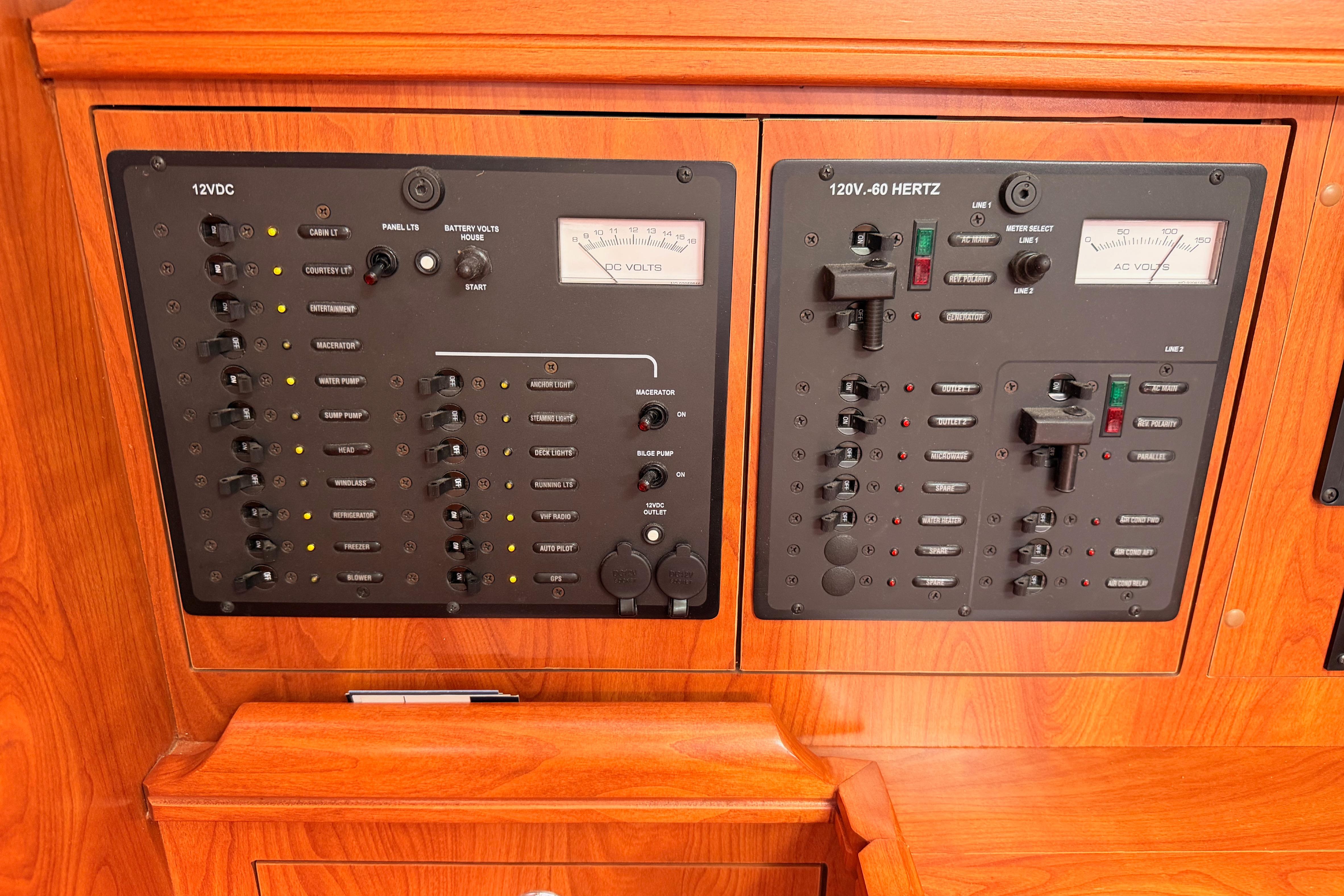 Electrical control panel on a 2009 Hunter 38 yacht, featuring 12VDC and 120V-60 Hertz systems.