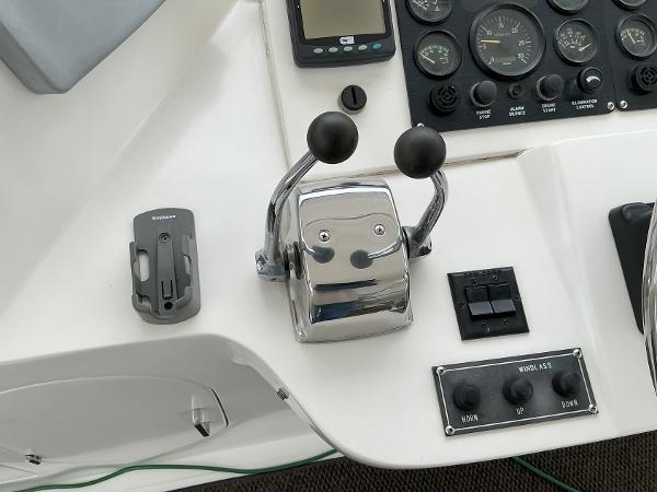 Control panel of a 2000 Novatec Islander 55 yacht with throttle levers and gauges.