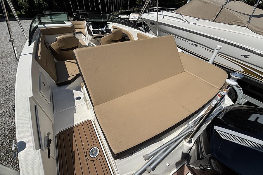 2019 Sea Ray SPX 230 Outboard boat with tan seating and sleek interior design.
