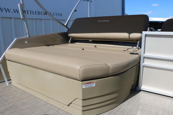 Sylvan Mirage 820 CLZ DH 2025 boat with tan seating and storage compartment.