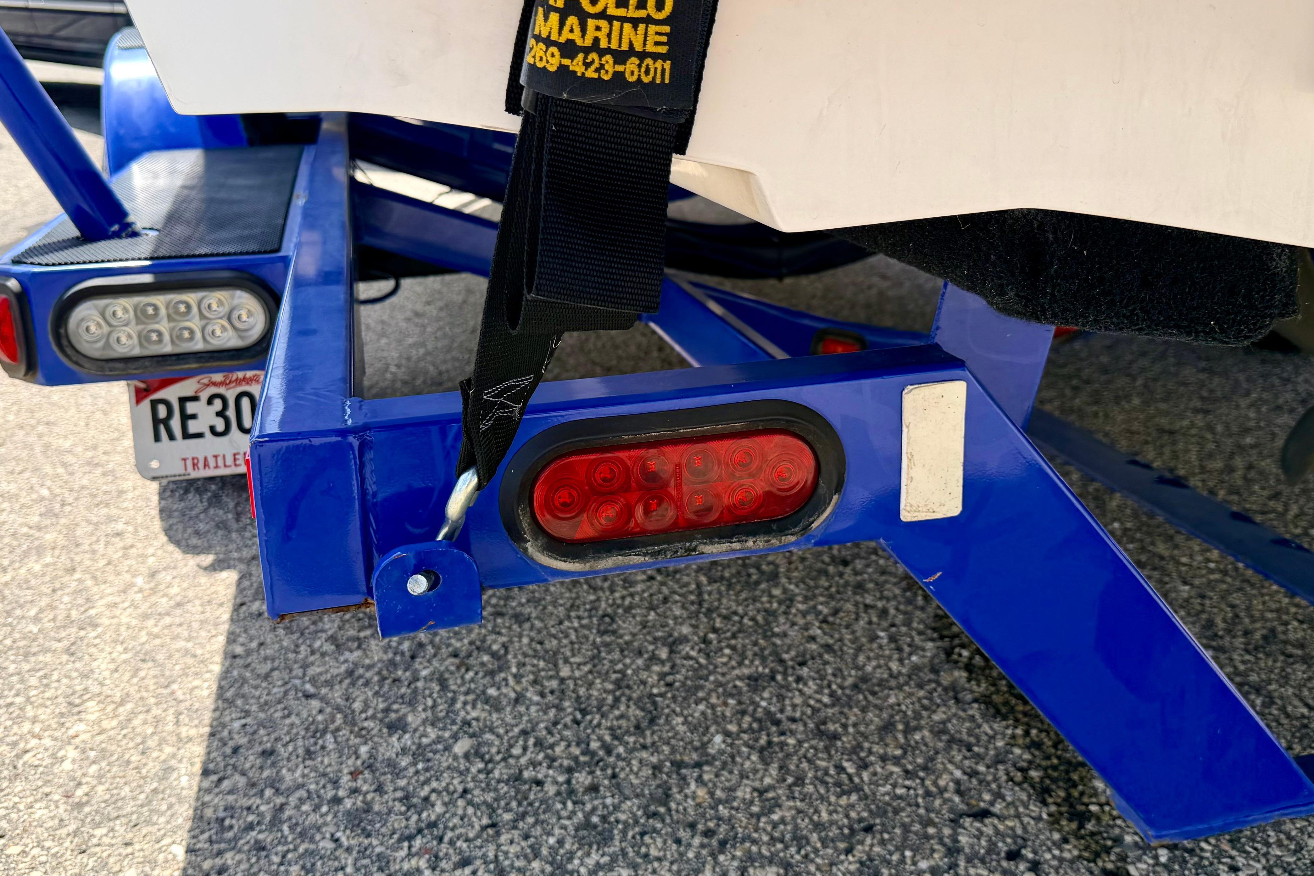 2008 Moomba Outback V trailer with blue frame and red tail lights.