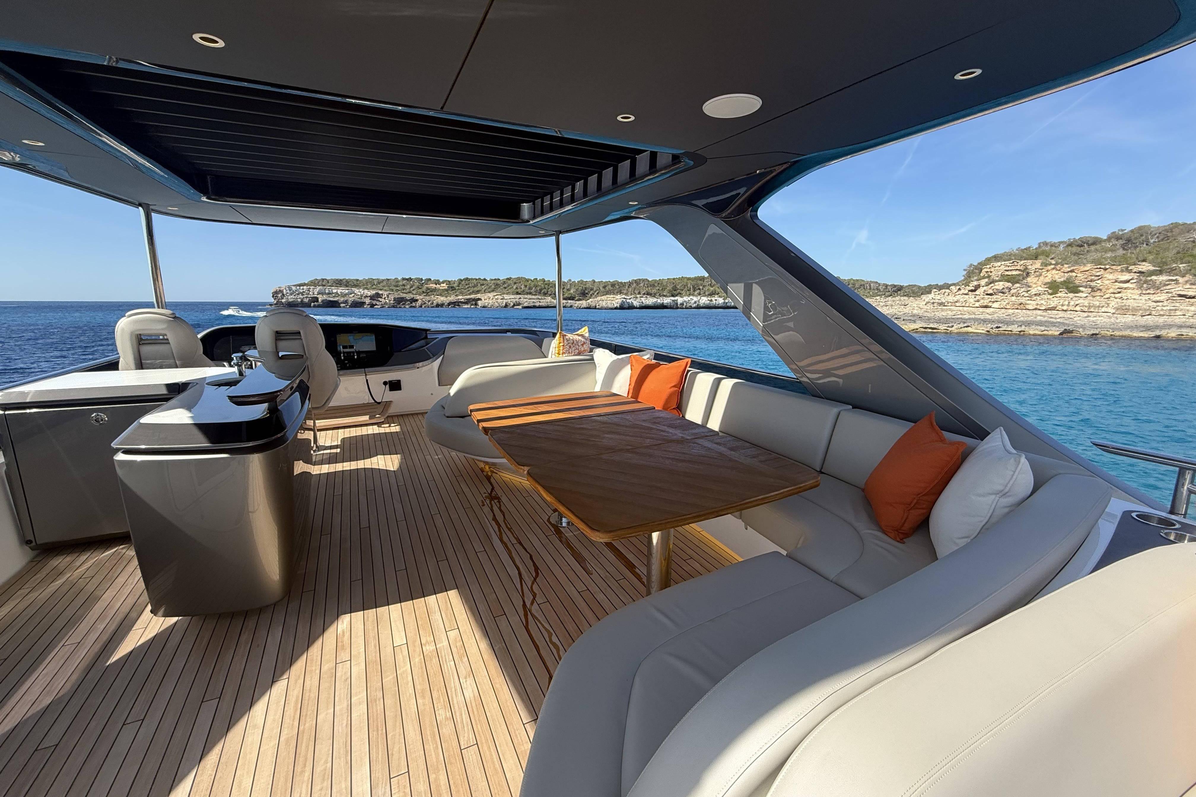 Luxurious 2025 Princess Y72 yacht deck with elegant seating and ocean view.