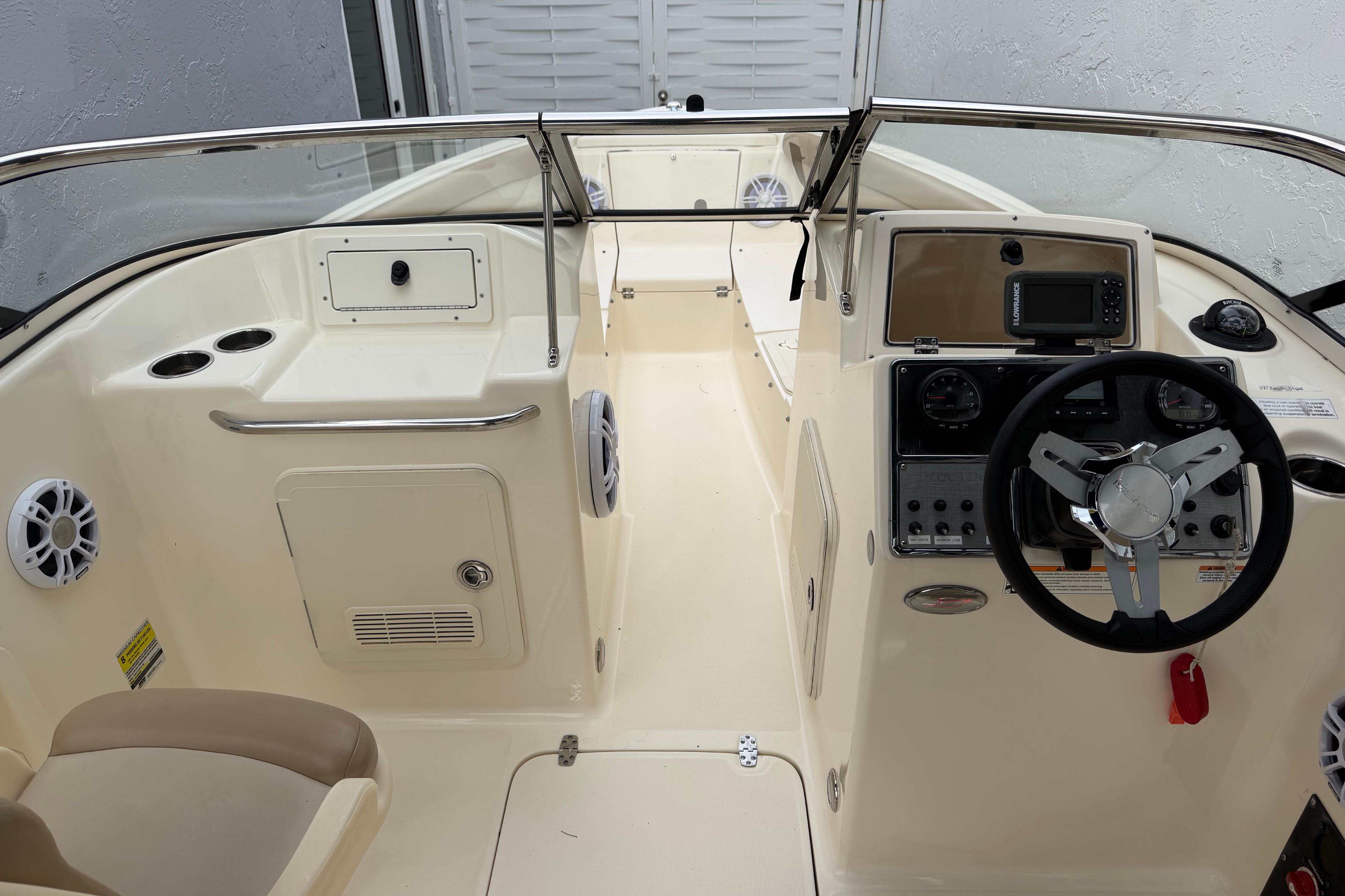 2023 Scout 210 Dorado boat interior with steering wheel and dashboard controls.