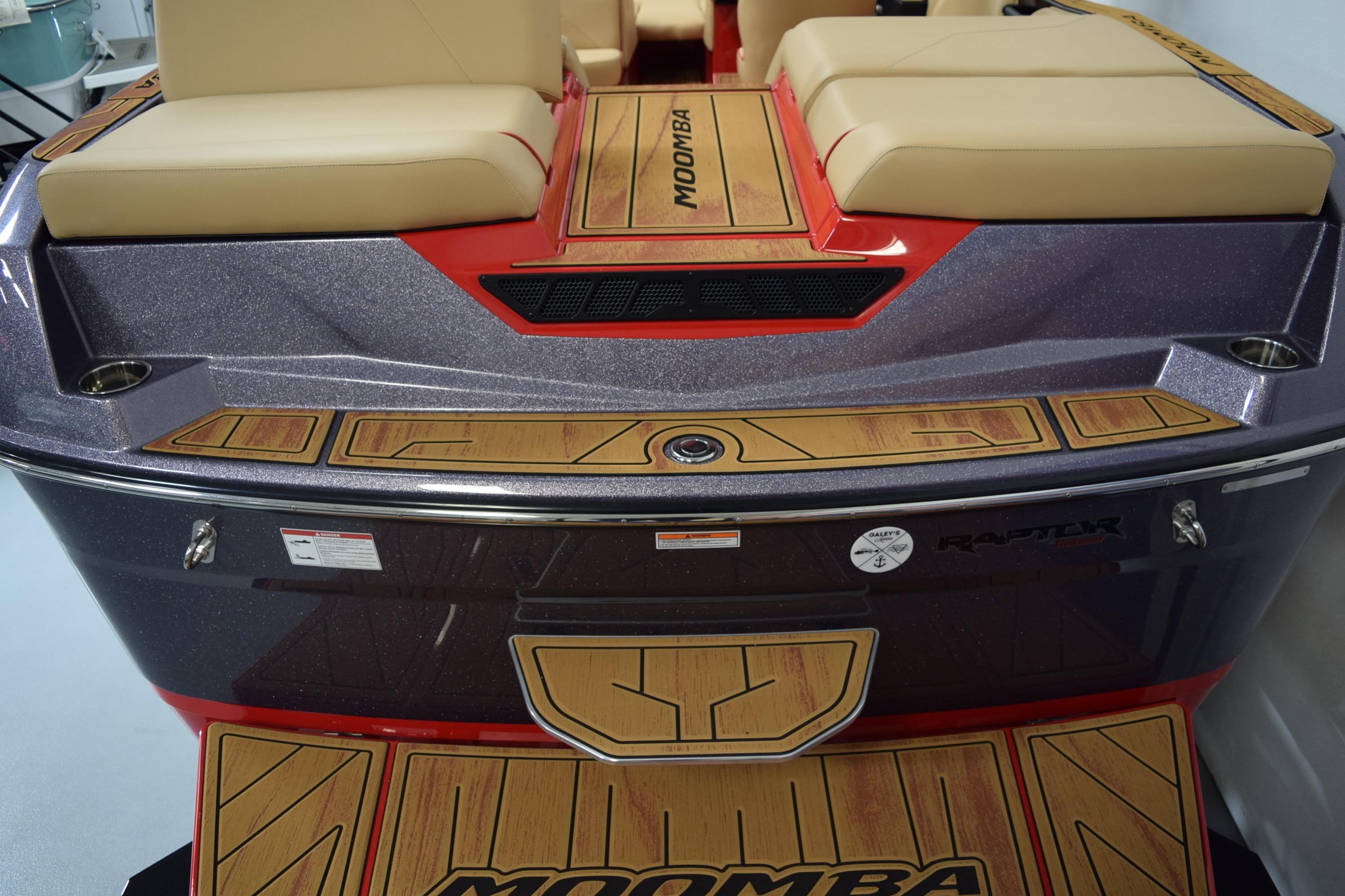 2026 Moomba Max boat with cushioned seating and stylish wood accents.