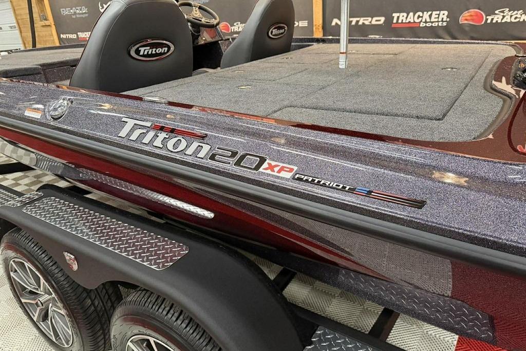 2026 Triton 20XP Patriot boat with sleek design and logo detailing.