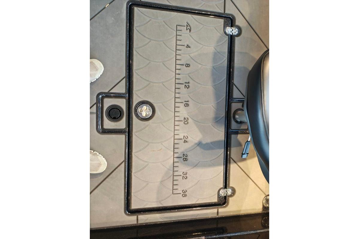 Ruler on Nitro ZV21 boat floor, 2026 model, with measurement markings.