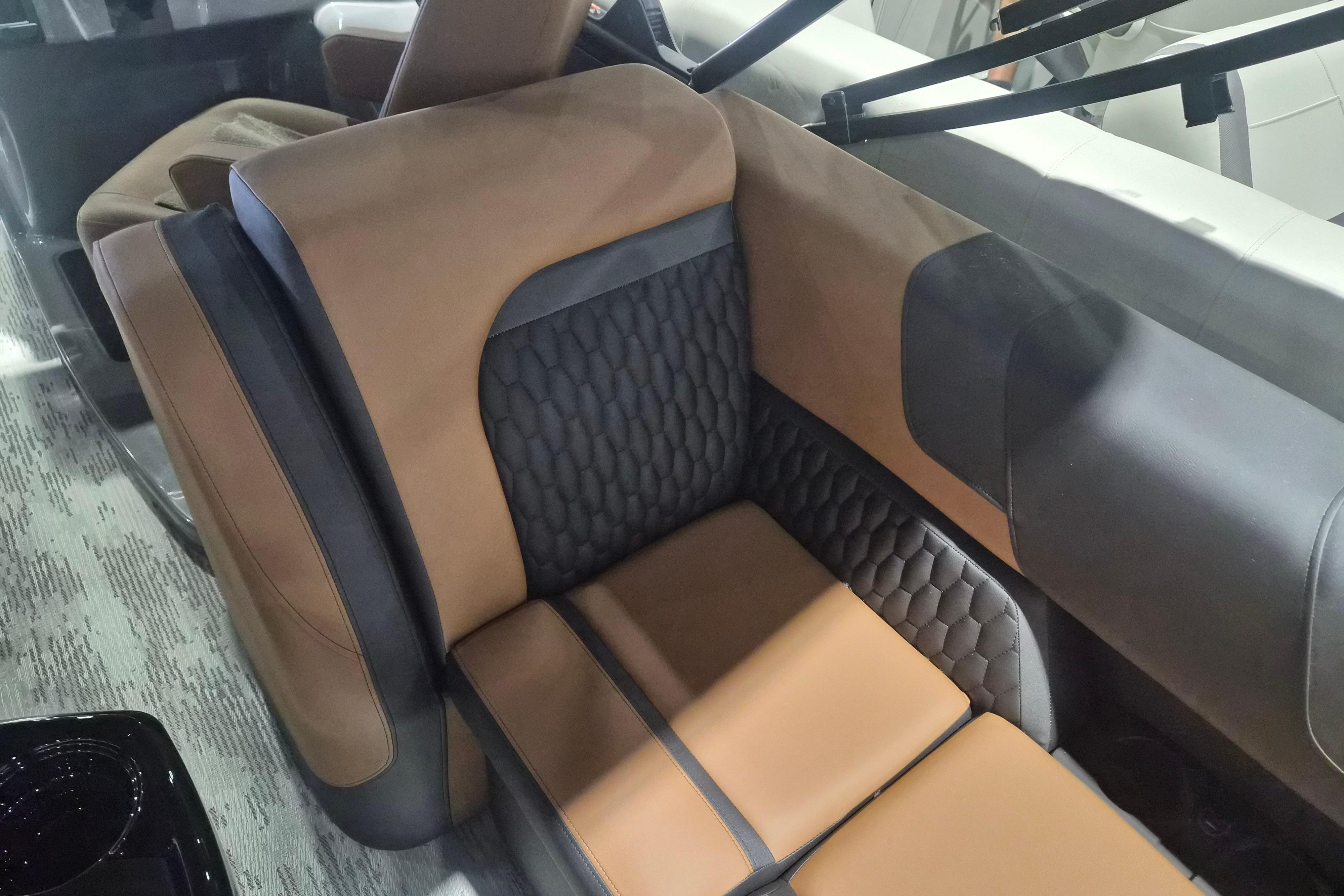 Luxurious interior seating of 2026 Sylvan L3 SLZ with brown and black upholstery.