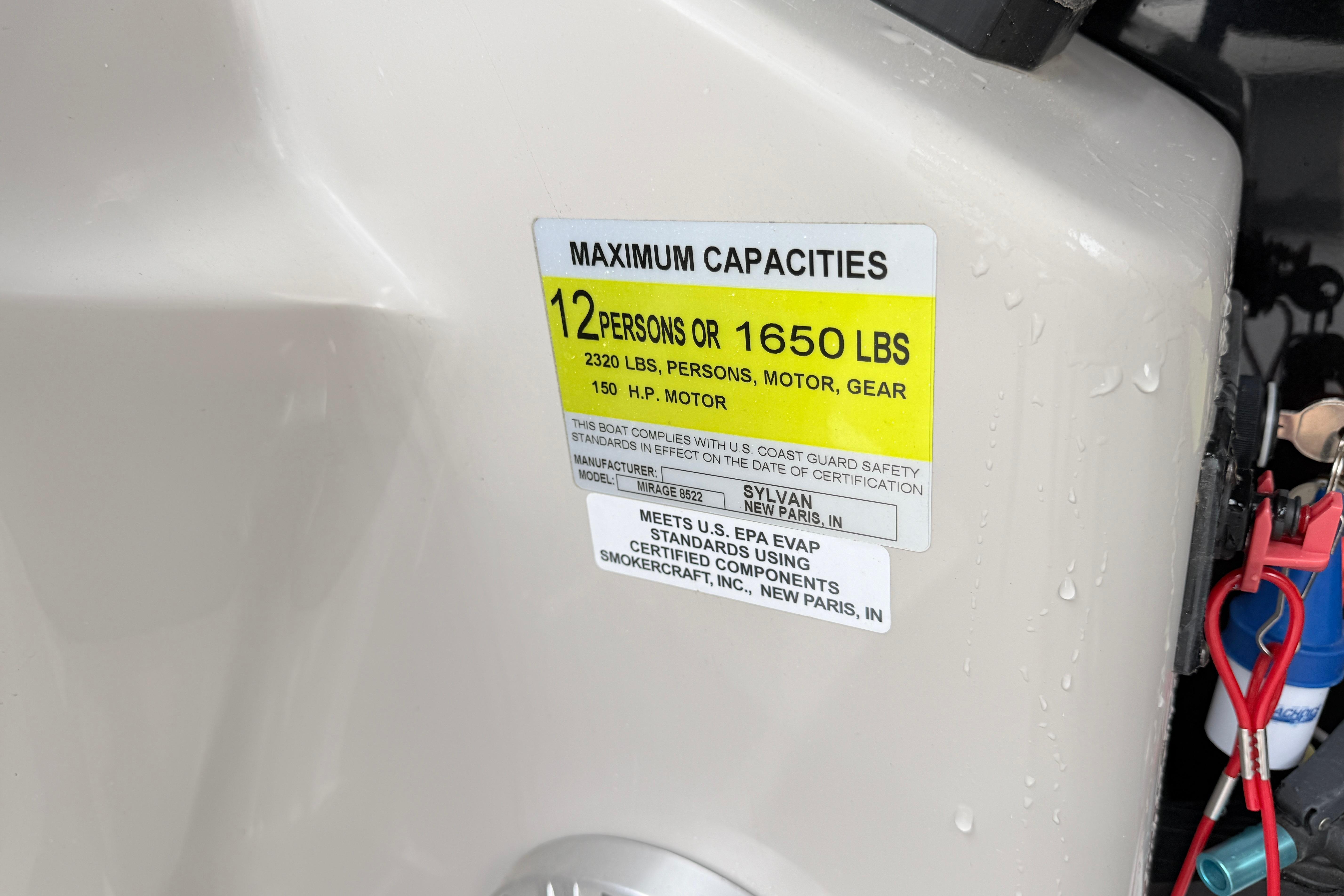 Capacity label on 2019 Sylvan 8522 Mirage Signature F-n-C boat, 12 persons or 1650 lbs.