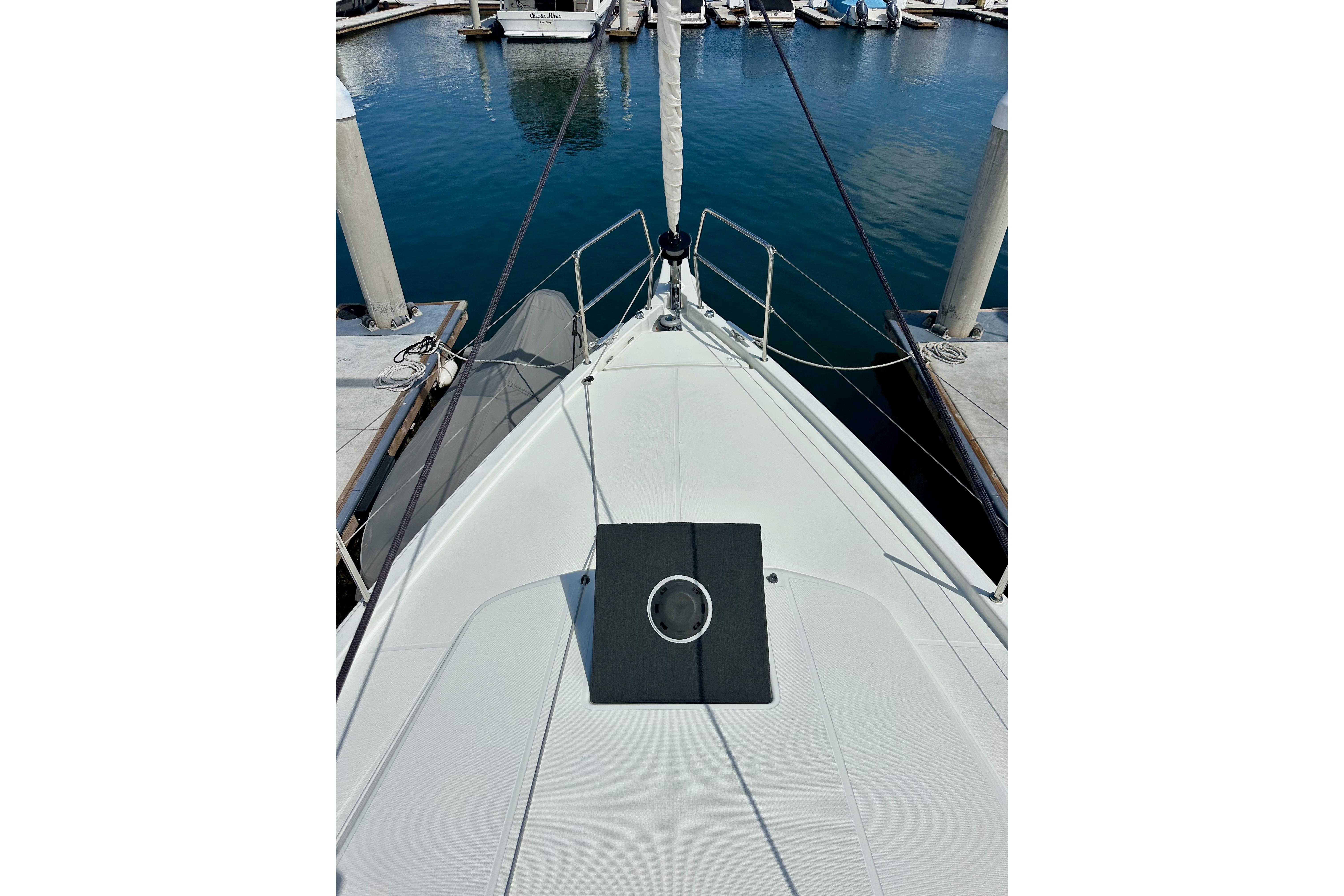 2024 Jeanneau Sun Odyssey 410 yacht bow view at marina dock.